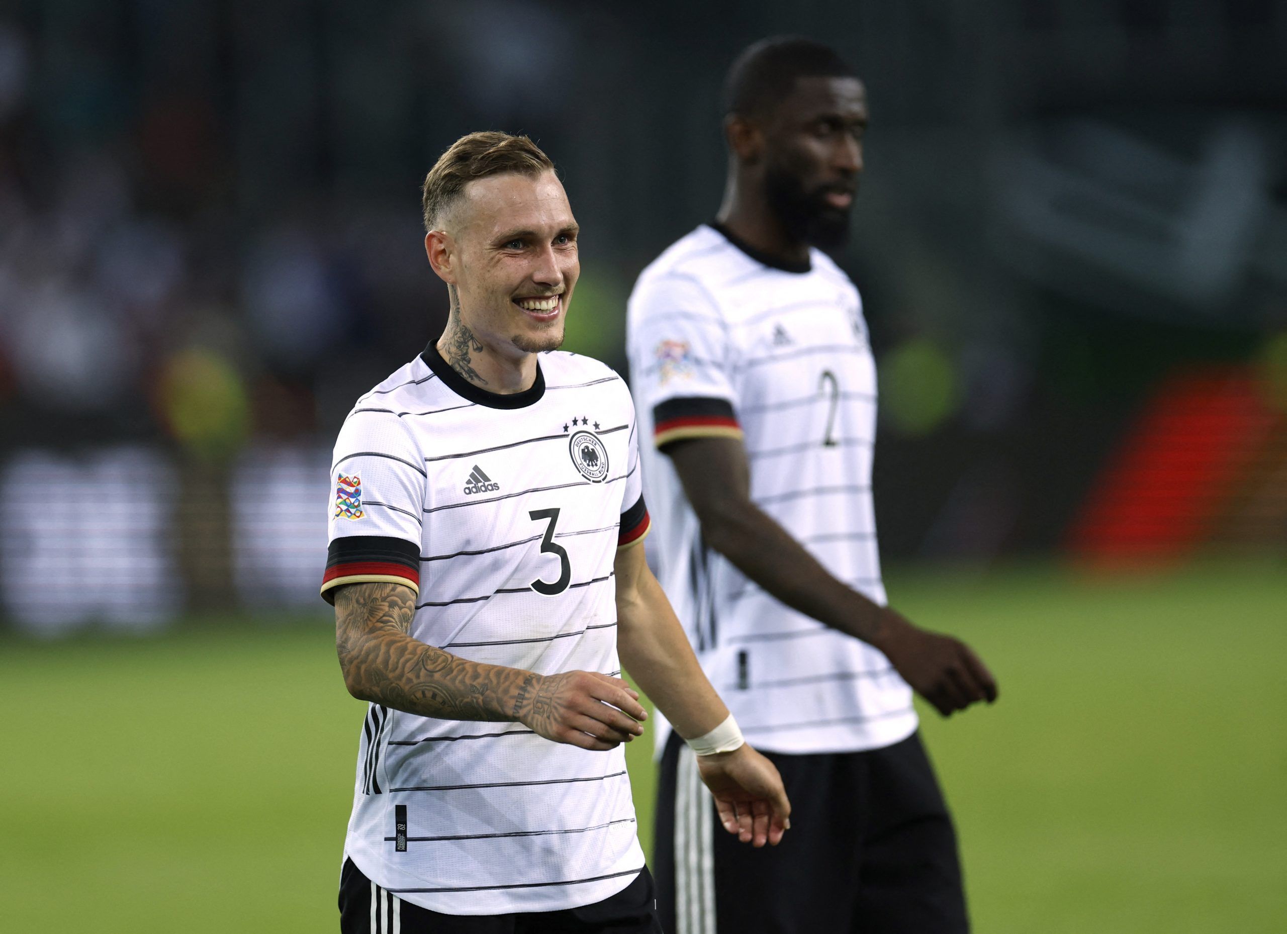 Soccer Football - UEFA Nations League - Group C - Germany v Italy - Borussia-Park, Moenchengladbach, Germany - June 14, 2022 Germany's David Raum and Antonio Rudiger celebrate after the match REUTERS/Heiko Becker