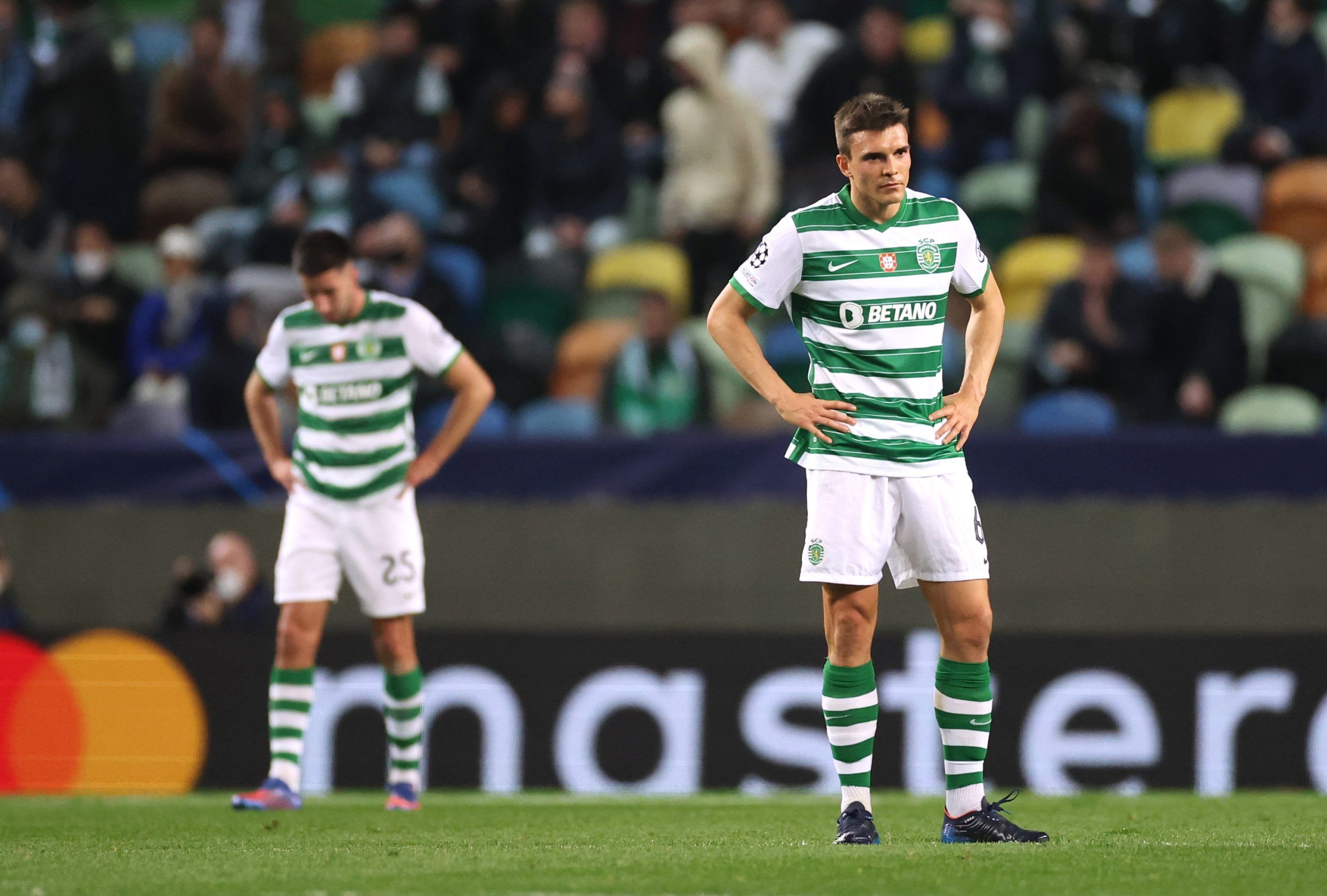 Soccer Football - Champions League - Round of 16 First Leg - Sporting CP v Manchester City - Estadio Jose Alvalade, Lisbon, Portugal - February 15, 2022 Sporting CP's Joao Palhinha looks dejected after Manchester City's Bernardo Silva scores their fourth goal Action Images via Reuters/Carl Recine