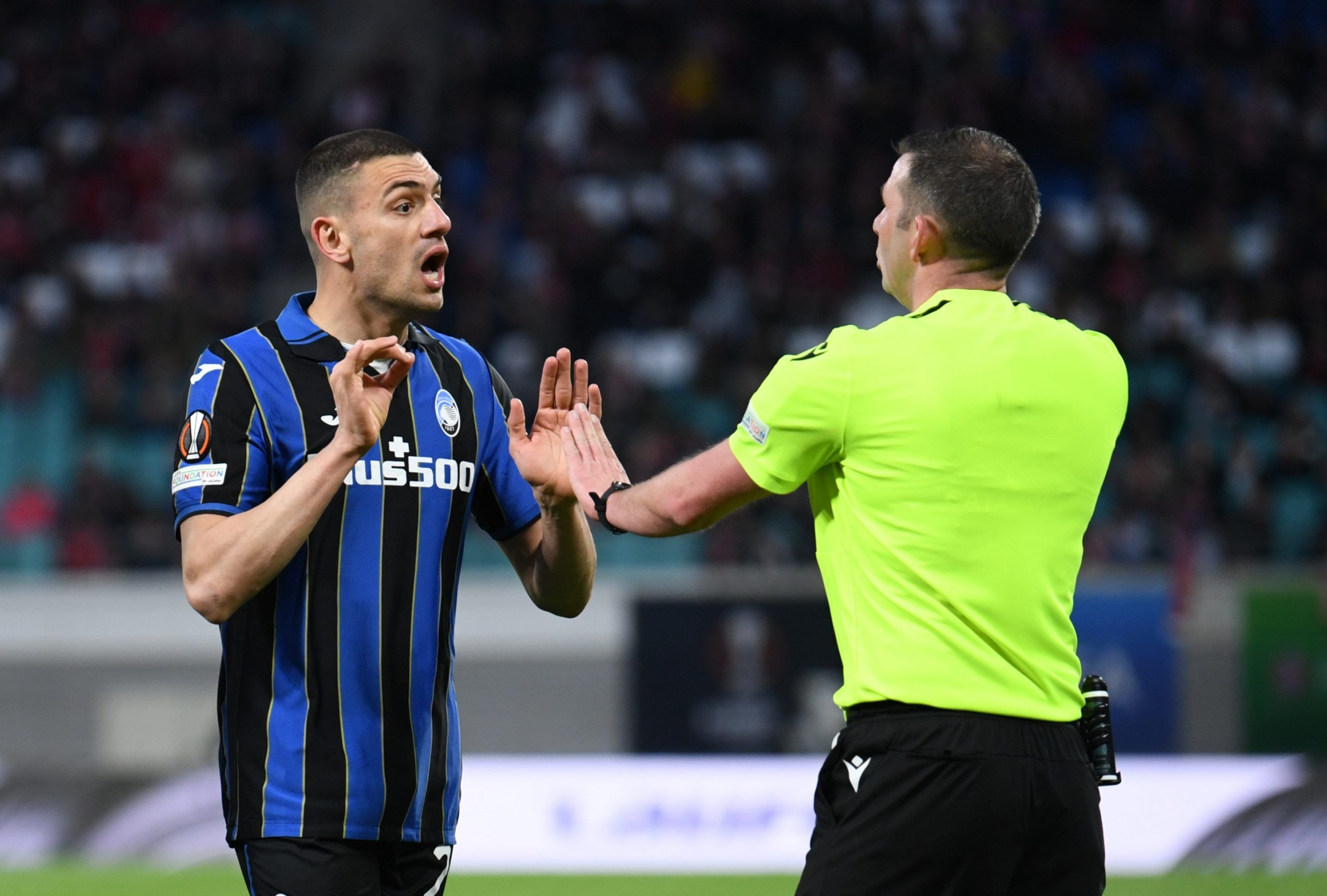 Soccer Football - Europa League - Quarter Final - First Leg - RB Leipzig v Atalanta - Red Bull Arena, Leipzig, Germany - April 7, 2022  Atalanta's Merih Demiral remonstrates with the referee REUTERS/Annegret Hilse