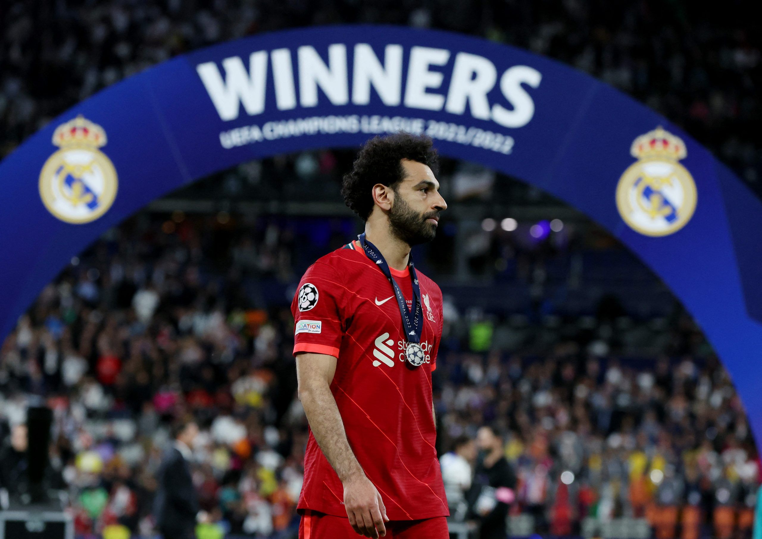 Soccer Football - Champions League Final - Liverpool v Real Madrid - Stade de France, Saint-Denis near Paris, France - May 28, 2022 Liverpool's Mohamed Salah looks dejected as he collects his runners up medal after the match REUTERS/Lee Smith