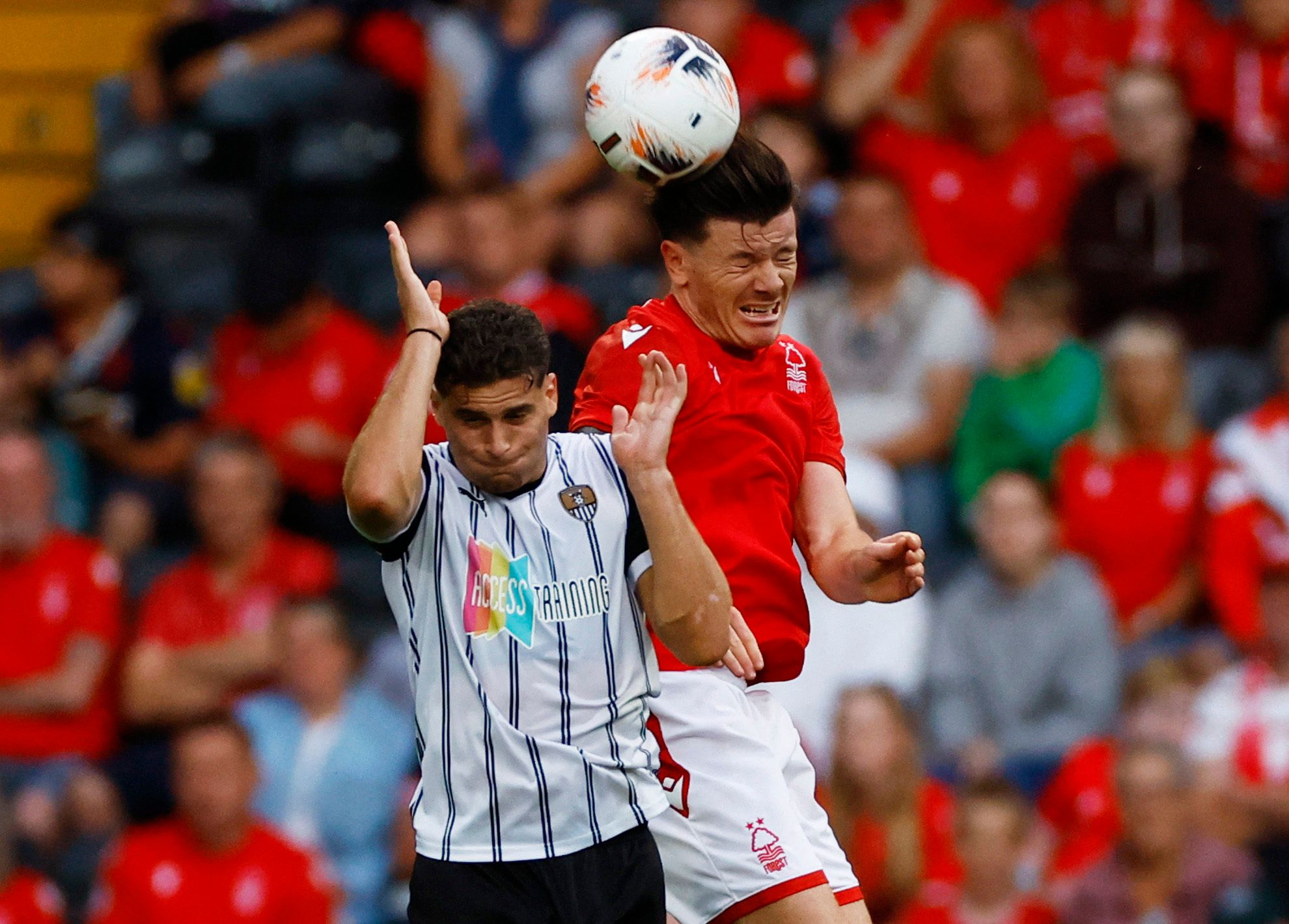 Soccer Football - Pre Season Friendly - Notts County v Nottingham Forest - Meadow Lane, Nottingham, Britain - July 26, 2022 Notts County Ruben Rodrigues in action with Nottingham Forest's Giulian Biancone Action Images via Reuters/Andrew Boyers