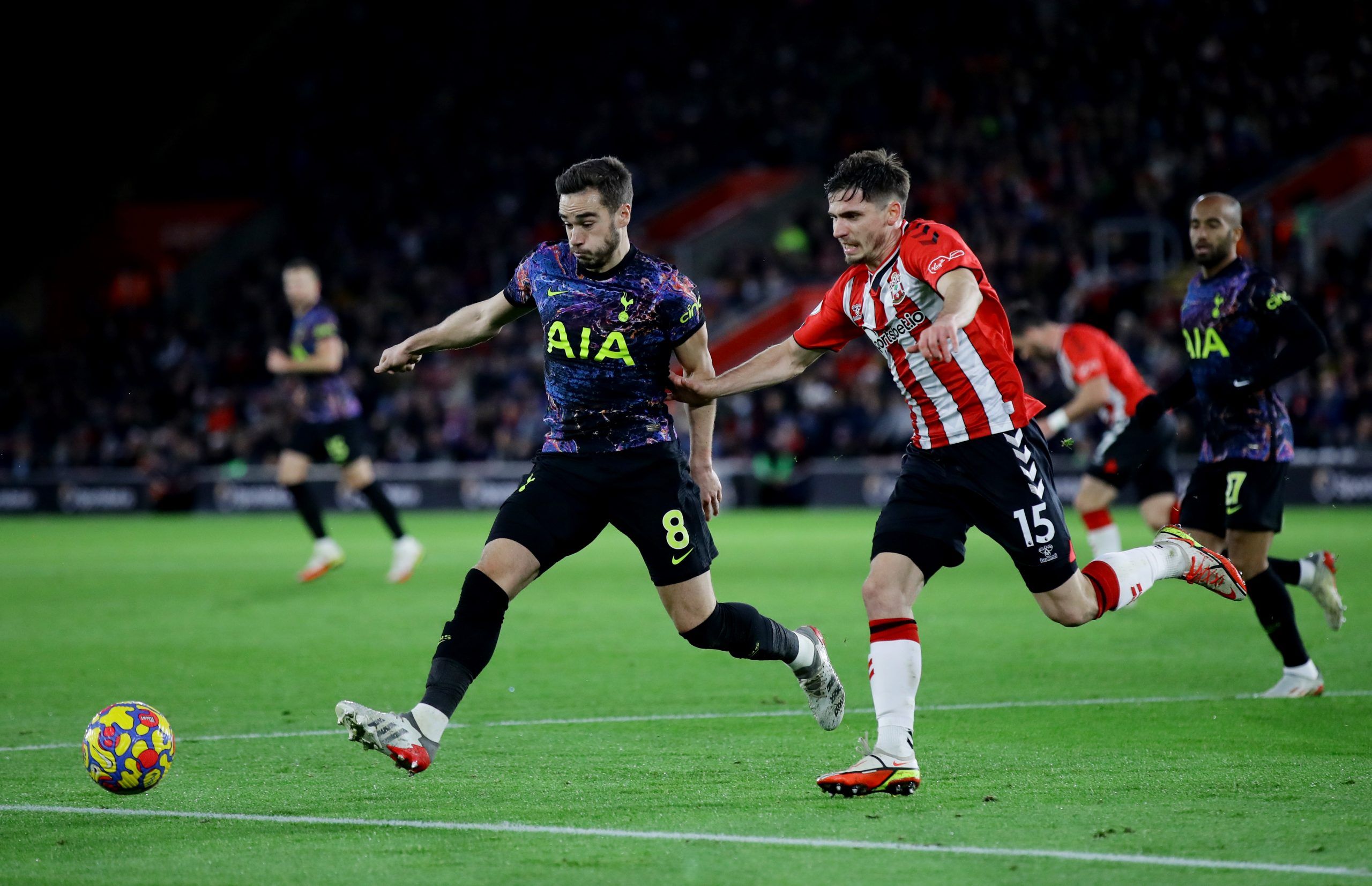 Soccer Football - Premier League - Southampton v Tottenham Hotspur - St Mary's Stadium, Southampton, Britain - December 28, 2021 Tottenham Hotspur's Harry Winks in action with Southampton's Romain Perraud REUTERS/David Klein EDITORIAL USE ONLY. No use with unauthorized audio, video, data, fixture lists, club/league logos or 'live' services. Online in-match use limited to 75 images, no video emulation. No use in betting, games or single club /league/player publications.  Please contact your accou