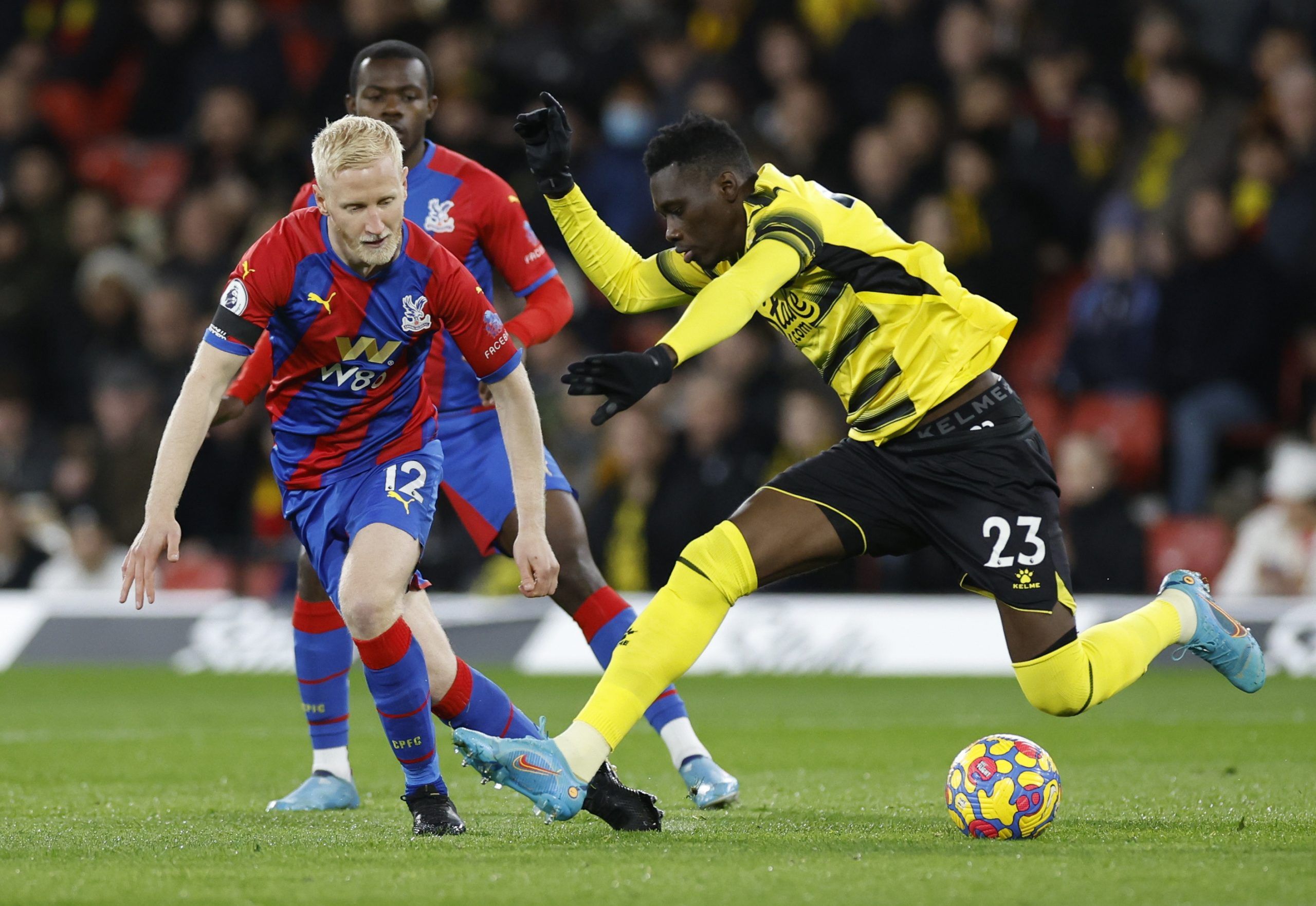 Soccer Football - Premier League - Watford v Crystal Palace - Vicarage Road, Watford, Britain - February 23, 2022 Crystal Palace's Will Hughes in action with Watford's Ismaila Sarr Action Images via Reuters/Peter Cziborra EDITORIAL USE ONLY. No use with unauthorized audio, video, data, fixture lists, club/league logos or 'live' services. Online in-match use limited to 75 images, no video emulation. No use in betting, games or single club /league/player publications.  Please contact your account 