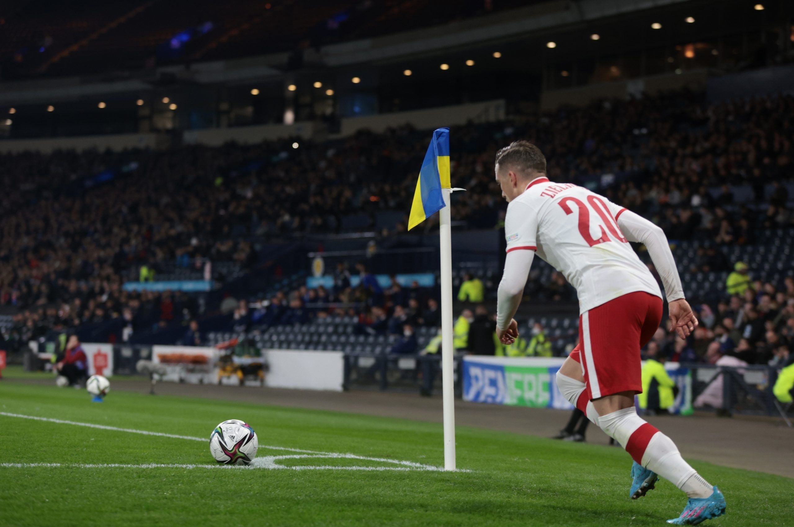 Soccer Football - International Friendly - Scotland v Poland - Hampden Park, Glasgow, Scotland, Britain - March 24, 2022 A corner flag is seen in support for Ukraine amid Russia's invasion as Poland's Piotr Zielinski takes a corner Action Images via Reuters/Lee Smith