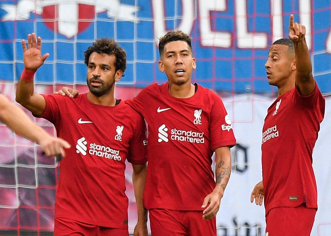 Soccer Football - Pre Season Friendly - RB Leipzig v Liverpool - Red Bull Arena, Leipzig, Germany - July 21, 2022 Liverpool's Mohamed Salah celebrates scoring their first goal with Roberto Firmino and Thiago Alcantara REUTERS/Matthias Rietschel