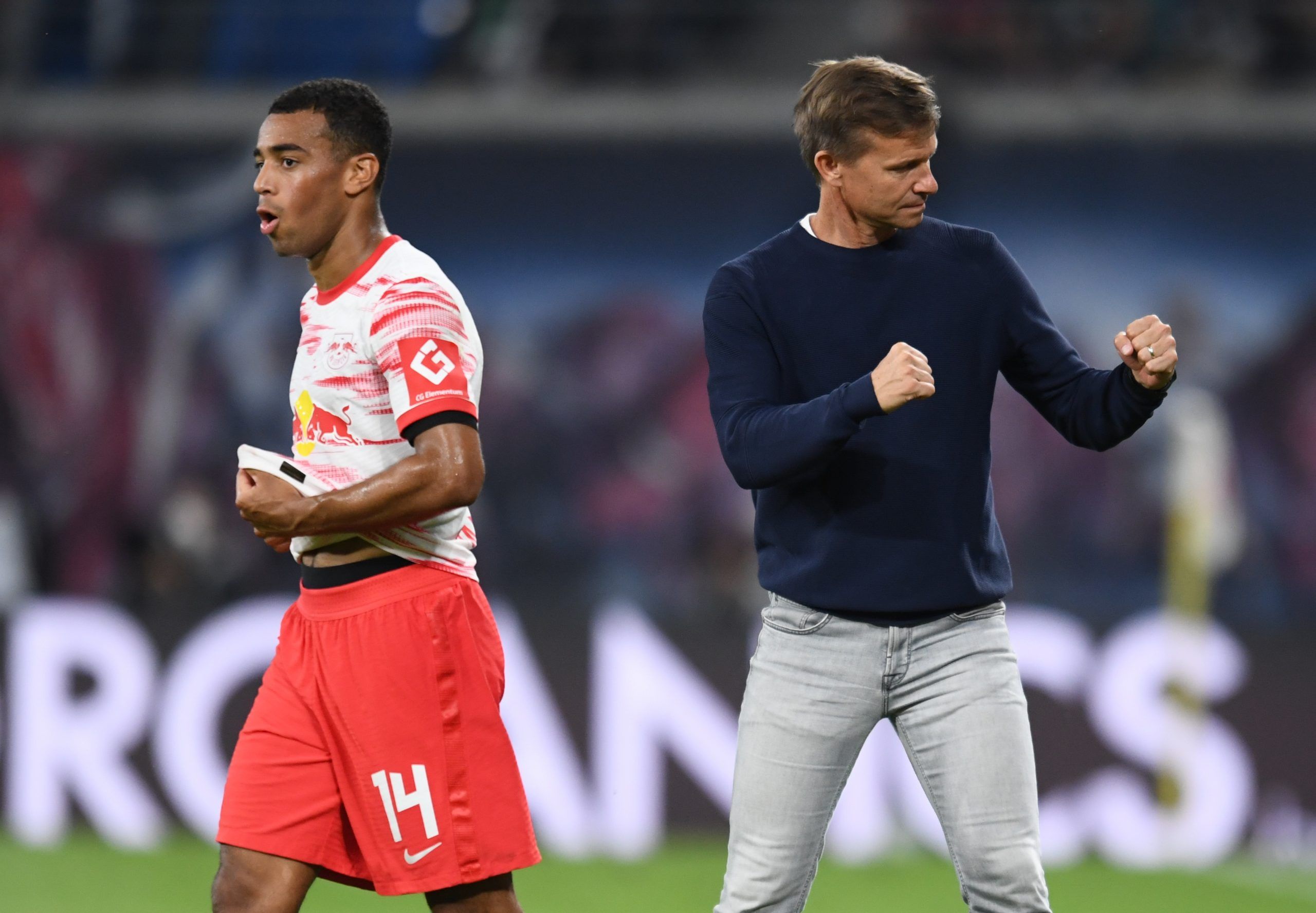 Soccer Football - Bundesliga - RB Leipzig v VfB Stuttgart - Red Bull Arena, Leipzig, Germany - August 20, 2021. RB Leipzig's Tyler Adams reacts and RB Leipzig coach Jesse Marsch celebrates after the match REUTERS/Annegret Hilse DFL regulations prohibit any use of photographs as image sequences and/or quasi-video.