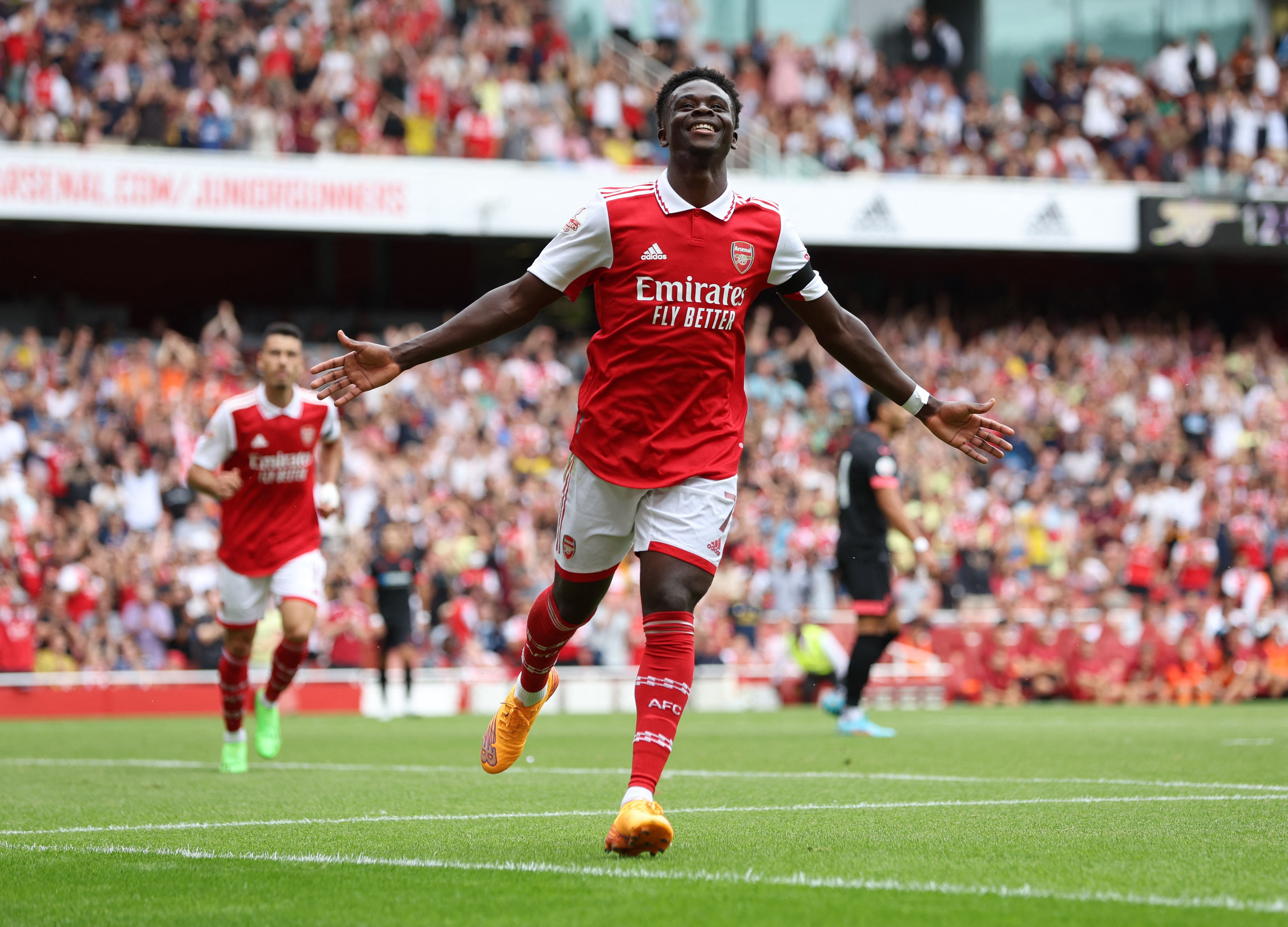 Arsenal's Bukayo Saka celebrates scoring against Sevilla in pre-season