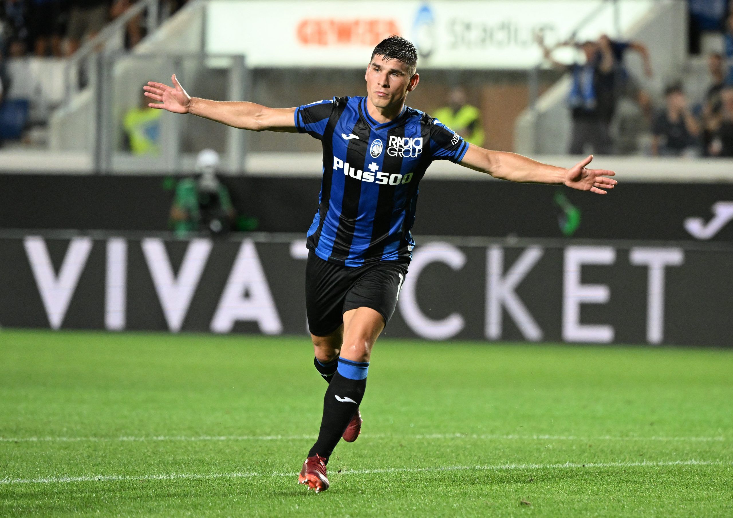 Atalanta's Ruslan Malinovskyi celebrates scoring their first goal vs Milan
