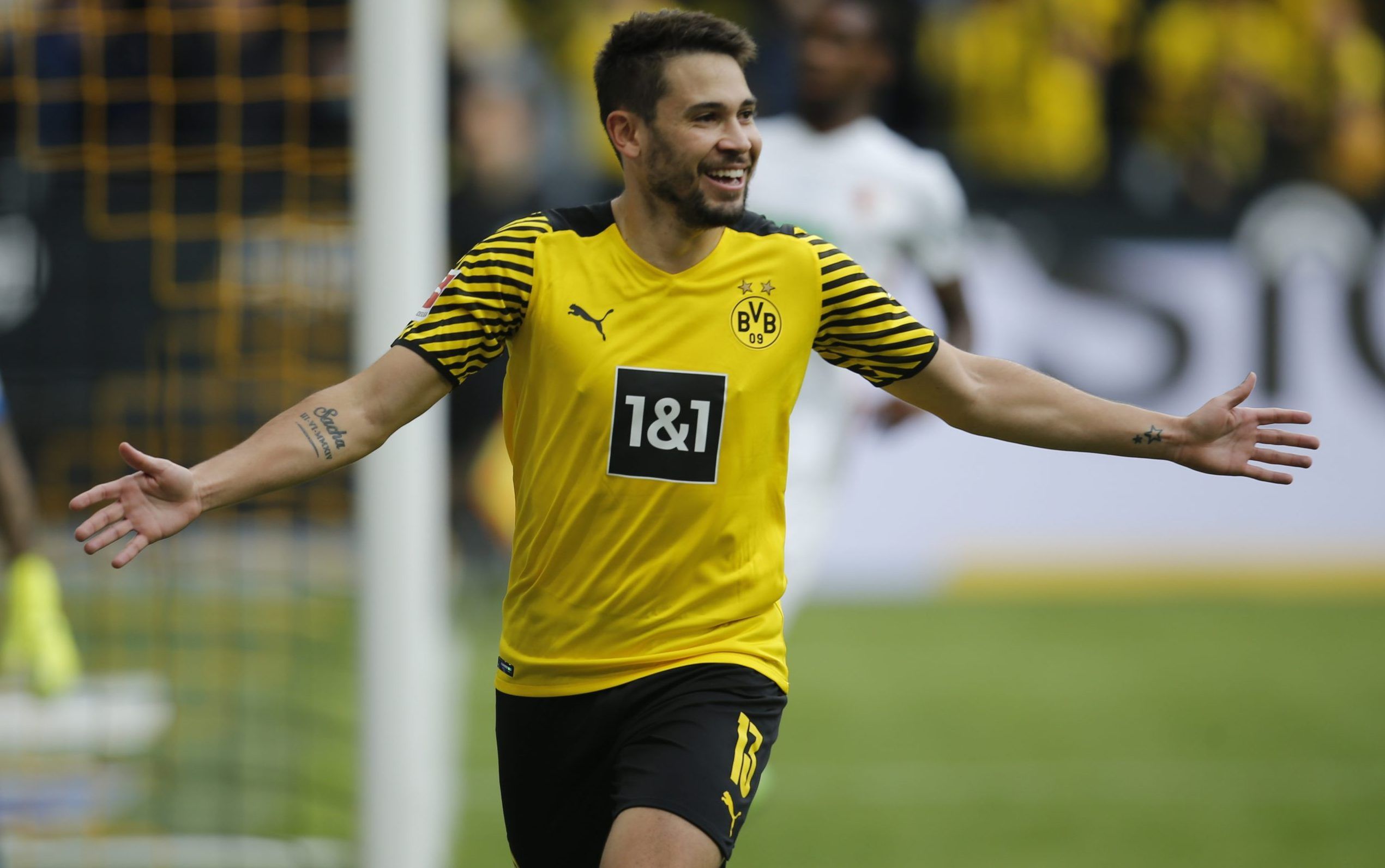 Borussia Dortmund's Raphael Guerreiro celebrates scoring their first goal