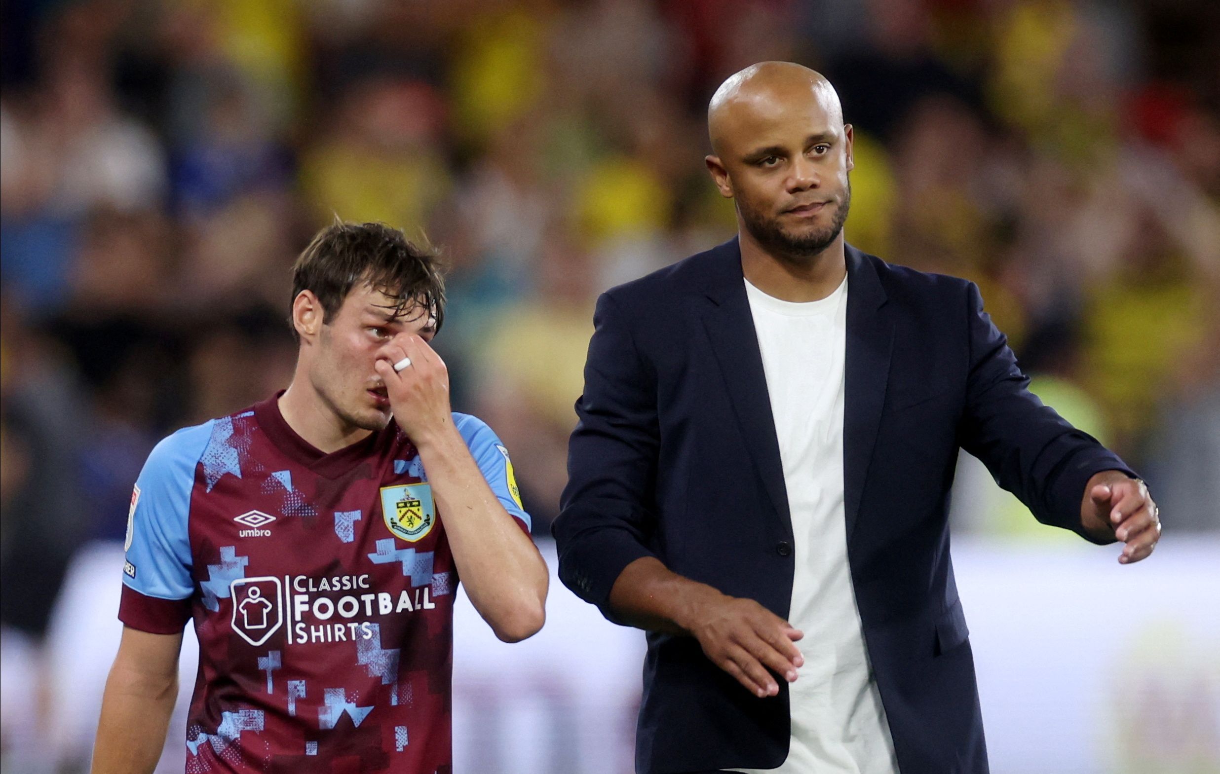 Soccer Football - Championship - Watford v Burnley - Vicarage Road, Watford, Britain - August 12, 2022 Burnley manager Vincent Kompany and Connor Roberts look dejected after the match Action Images/Paul Childs  EDITORIAL USE ONLY. No use with unauthorized audio, video, data, fixture lists, club/league logos or 