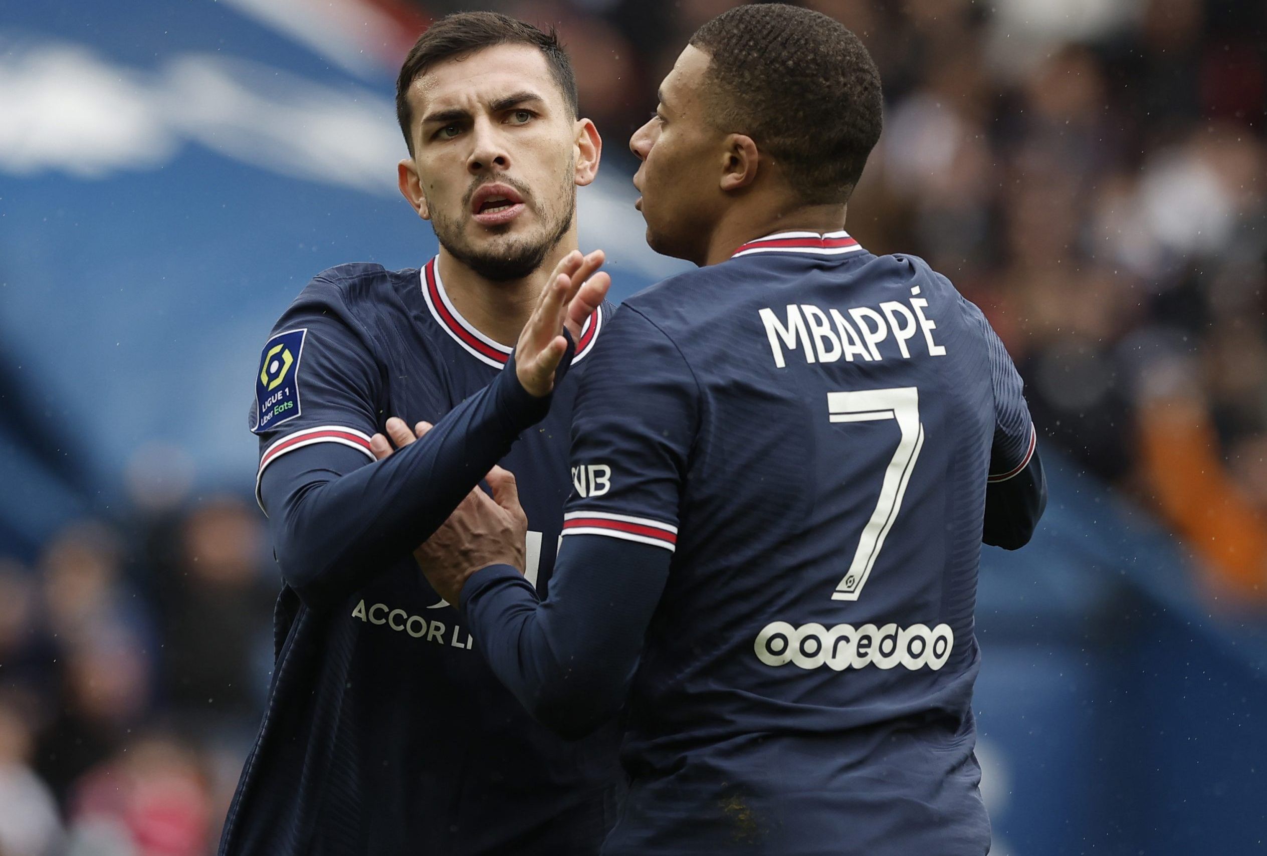 PSG midfielder Leandro Paredes celebrates with Kylian Mbappe