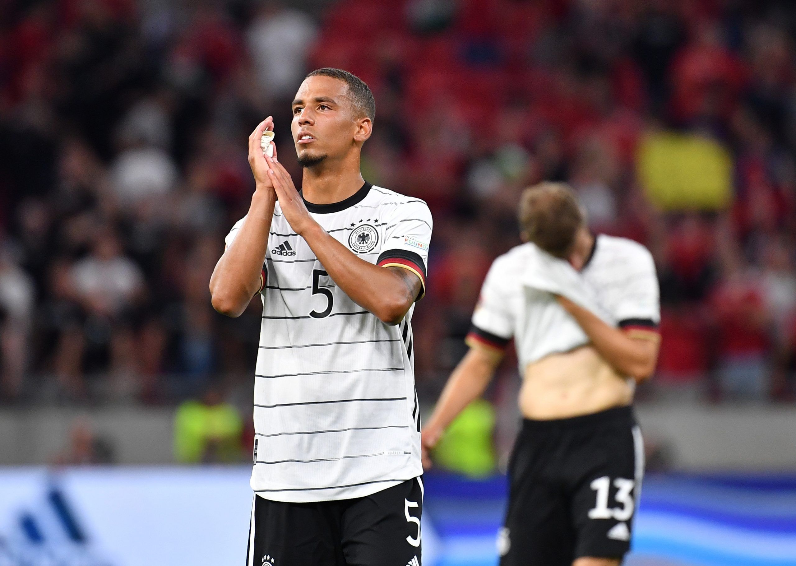 Soccer Football - UEFA Nations League - Group C - Hungary v Germany - Puskas Arena Park, Budapest, Hungary - June 11, 2022 Germany's Thilo Kehrer applauds fans after the match REUTERS/Marton Monus