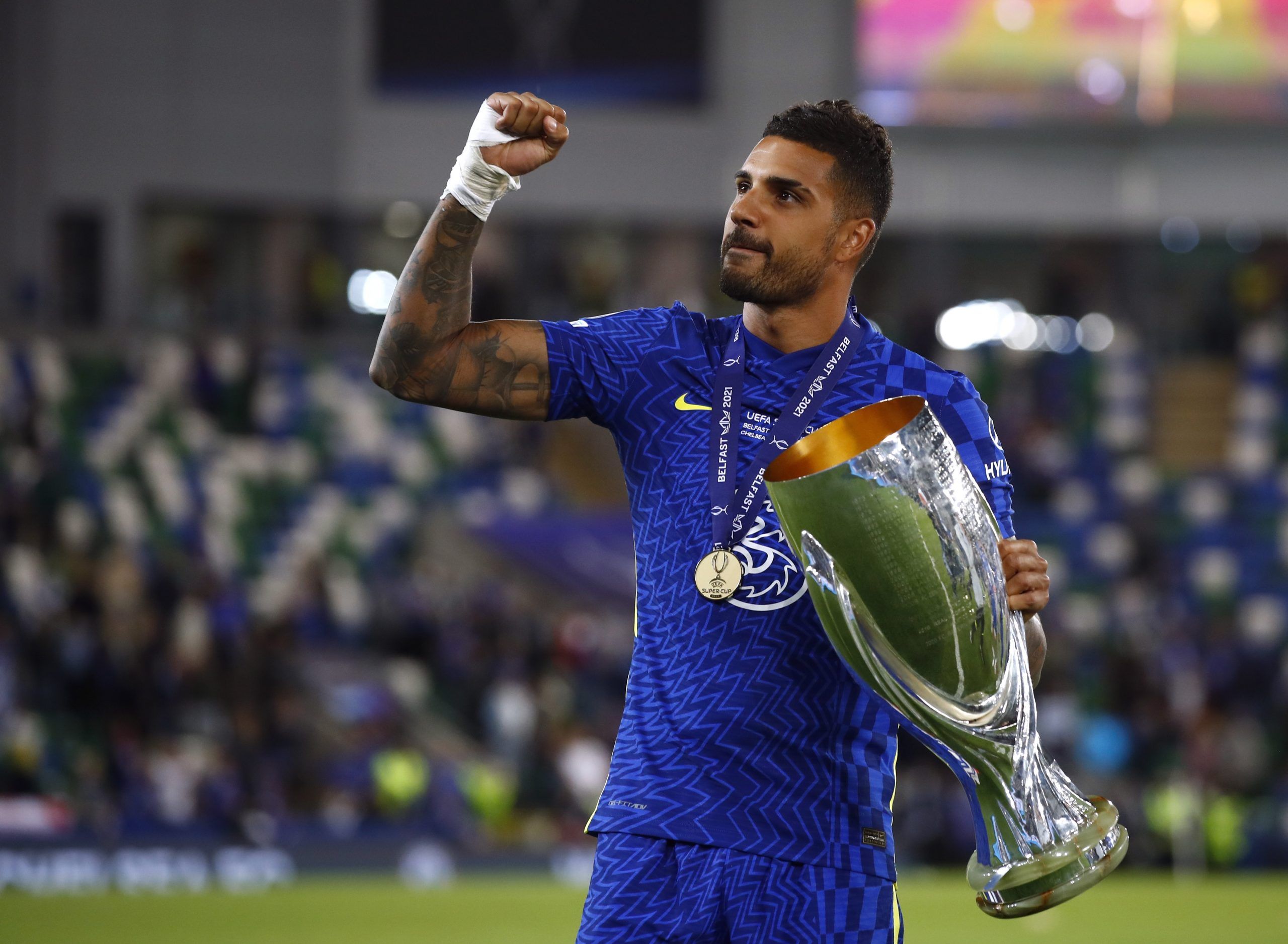 Soccer Football - European Super Cup - Chelsea v Villarreal - Windsor Park, Belfast, Northern Ireland - August 11, 2021 Chelsea's Emerson celebrates with the trophy after winning the penalty shoot-out and the European Super Cup Action Images via Reuters/Jason Cairnduff