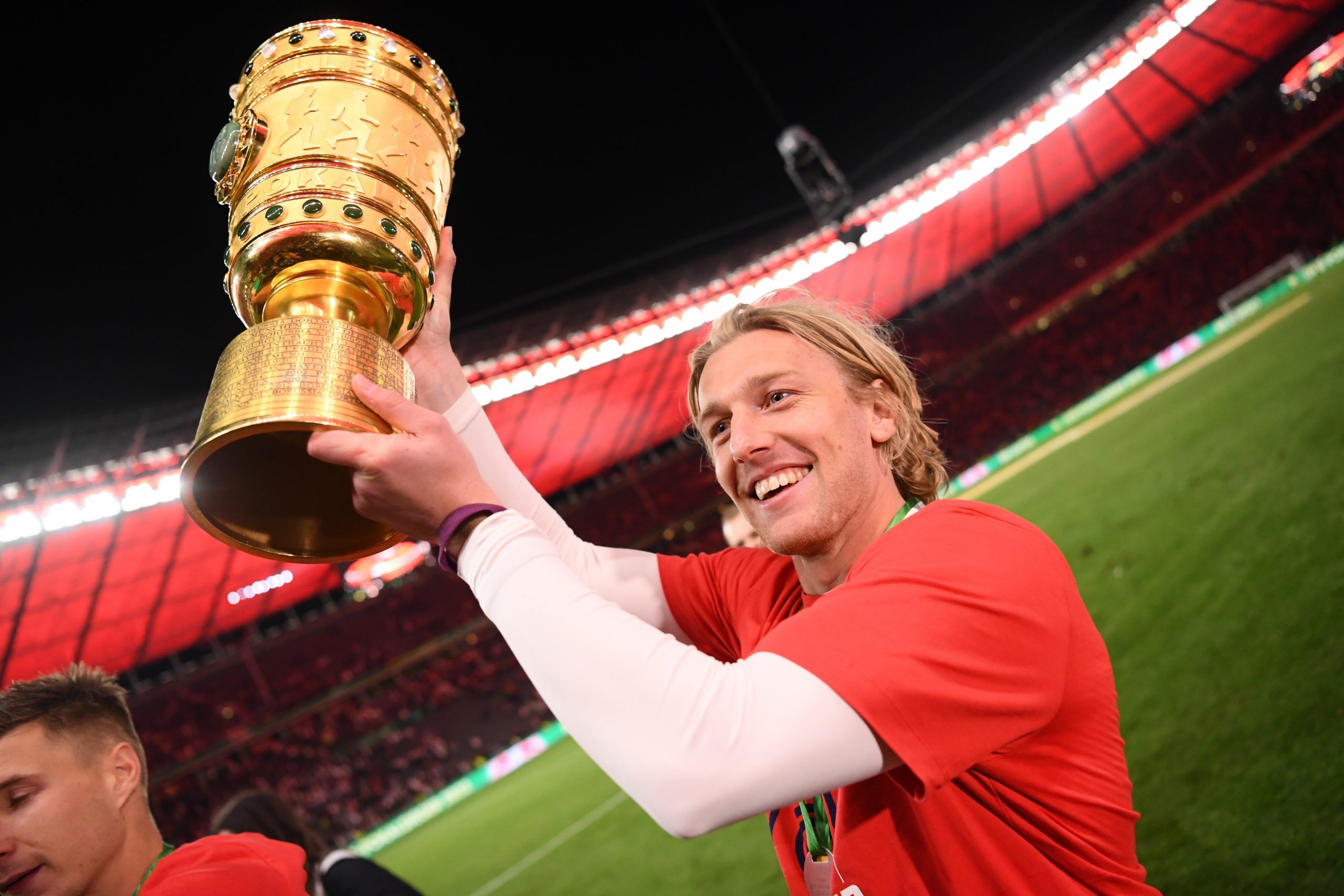 Soccer Football - DFB Cup - Final - SC Freiburg v RB Leipzig - Olympiastadion, Berlin, Germany - May 21, 2022  RB Leipzig's Emil Forsberg celebrates with the trophy after winning the final REUTERS/Annegret Hilse DFB REGULATIONS PROHIBIT ANY USE OF PHOTOGRAPHS AS IMAGE SEQUENCES AND/OR QUASI-VIDEO.