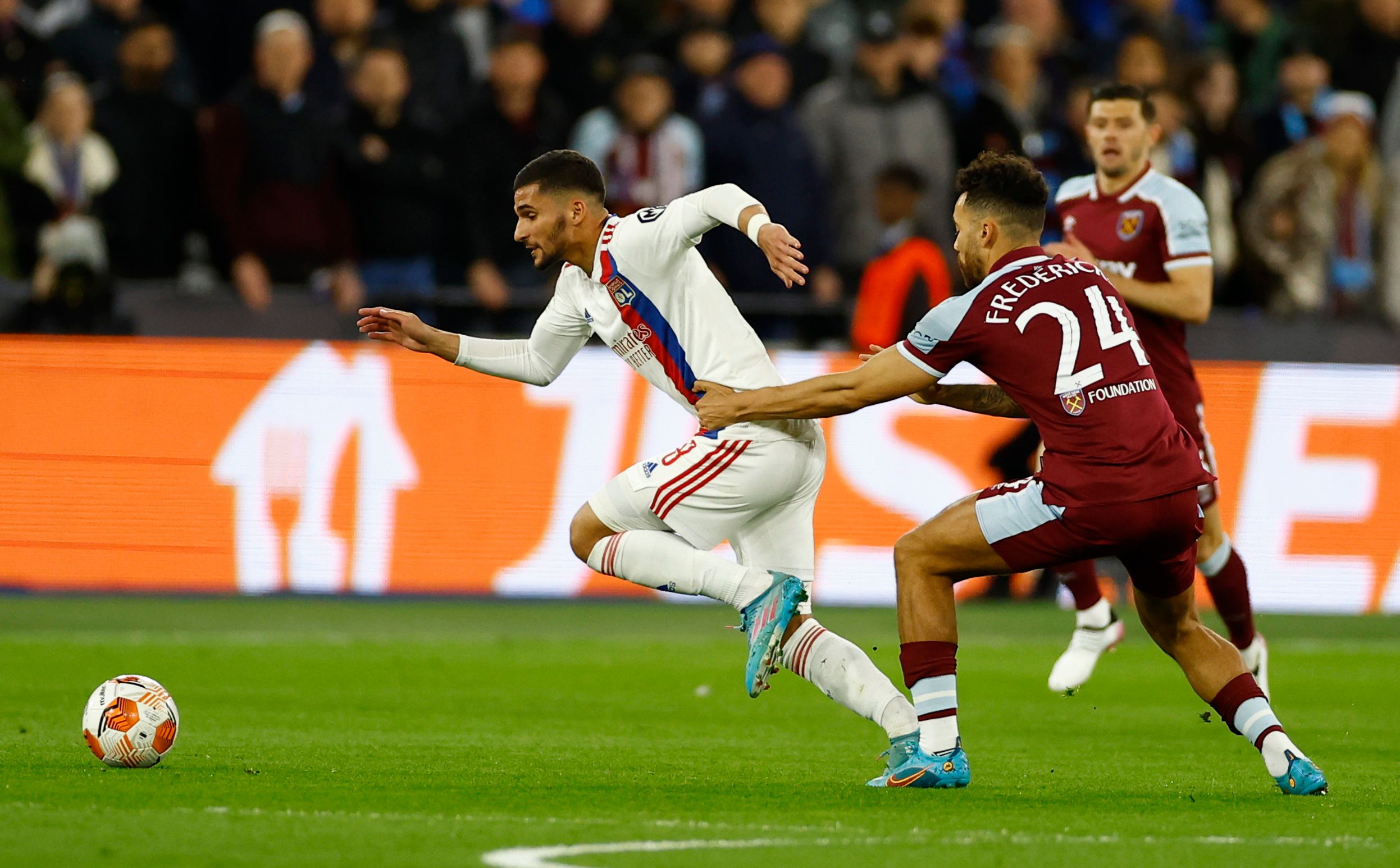 Soccer Football - Europa League - Quarter Final - First Leg - West Ham United v Olympique Lyonnais - London Stadium, London, Britain - April 7, 2022  Olympique Lyonnais' Houssem Aouar in action with West Ham United's Ryan Fredericks Action Images via Reuters/Andrew Boyers