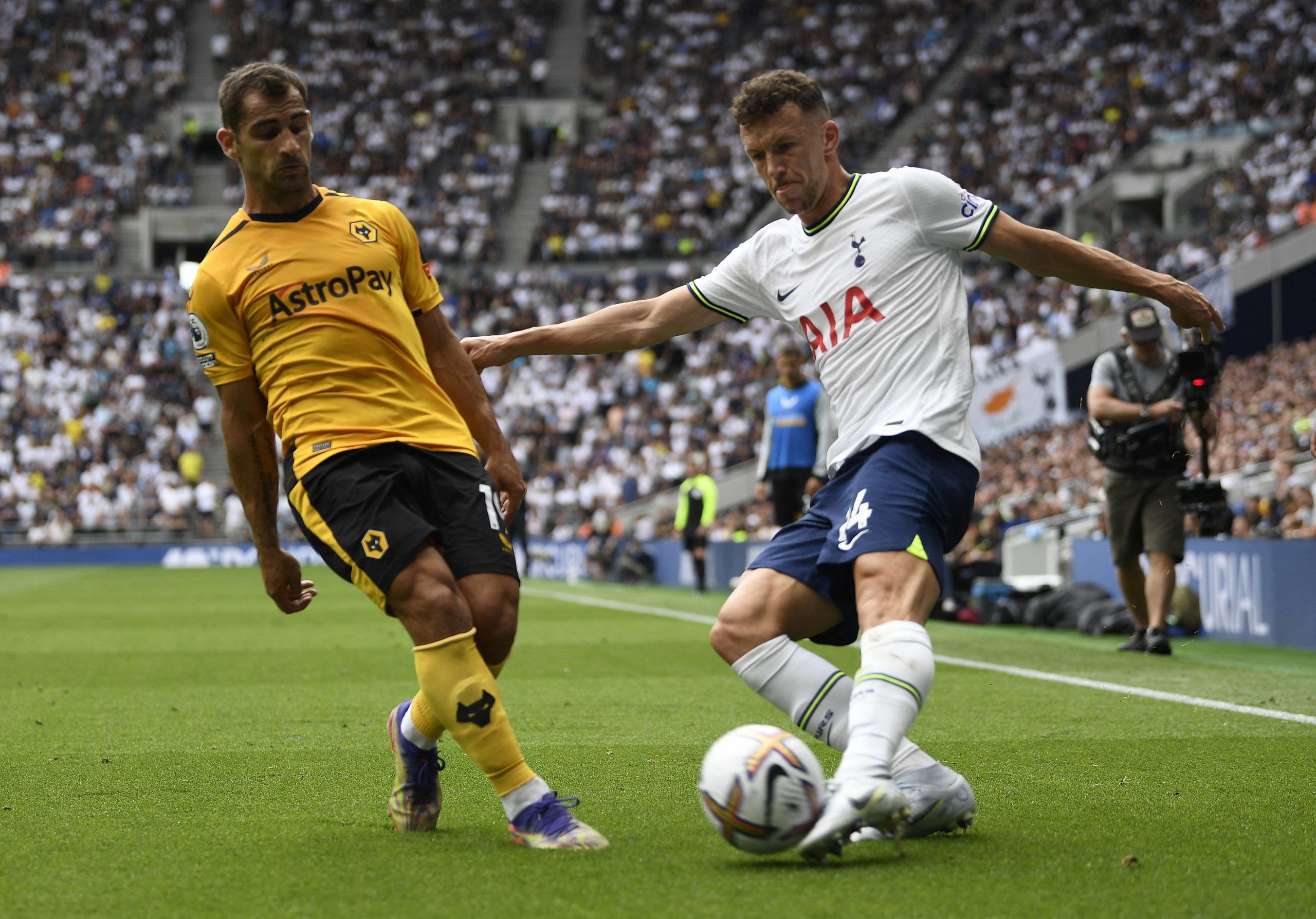 Soccer Football - Premier League - Tottenham Hotspur v Wolverhampton Wanderers - Tottenham Hotspur Stadium, London, Britain - August 20, 2022 Wolverhampton Wanderers' Jonny in action with Tottenham Hotspur's Ivan Perisic REUTERS/Tony Obrien EDITORIAL USE ONLY. No use with unauthorized audio, video, data, fixture lists, club/league logos or 'live' services. Online in-match use limited to 75 images, no video emulation. No use in betting, games or single club /league/player publications.  Please co