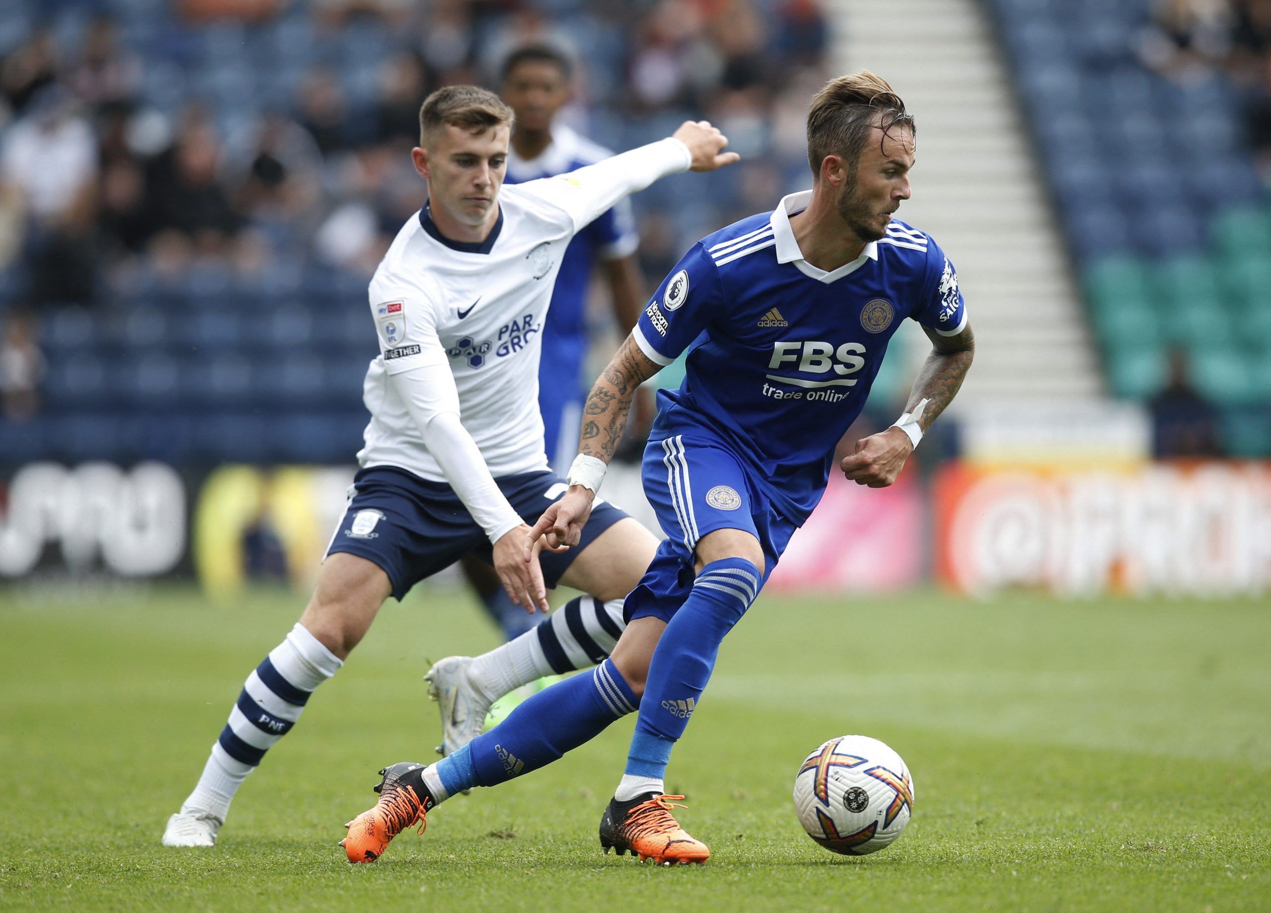 Soccer Football - Pre Season Friendly - Preston North End v Leicester City - Deepdale Stadium, Preston, Britain - July 23, 2022 Leicester City's James Maddison in action with Preston North End's Ben Woodburn Action Images via Reuters/Ed Sykes