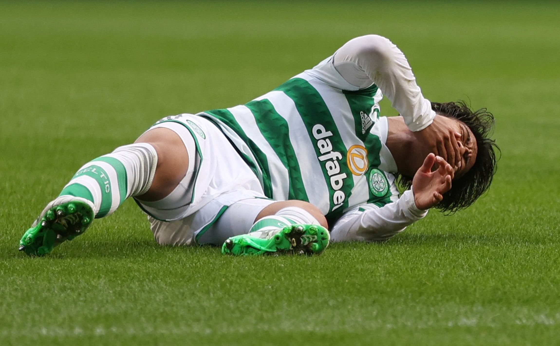 Soccer Football - Scottish Premiership - Celtic v Aberdeen - Celtic Park, Glasgow, Scotland, Britain - July 31, 2022 Celtic's Reo Hatate after sustaining an injury REUTERS/Russell Cheyne