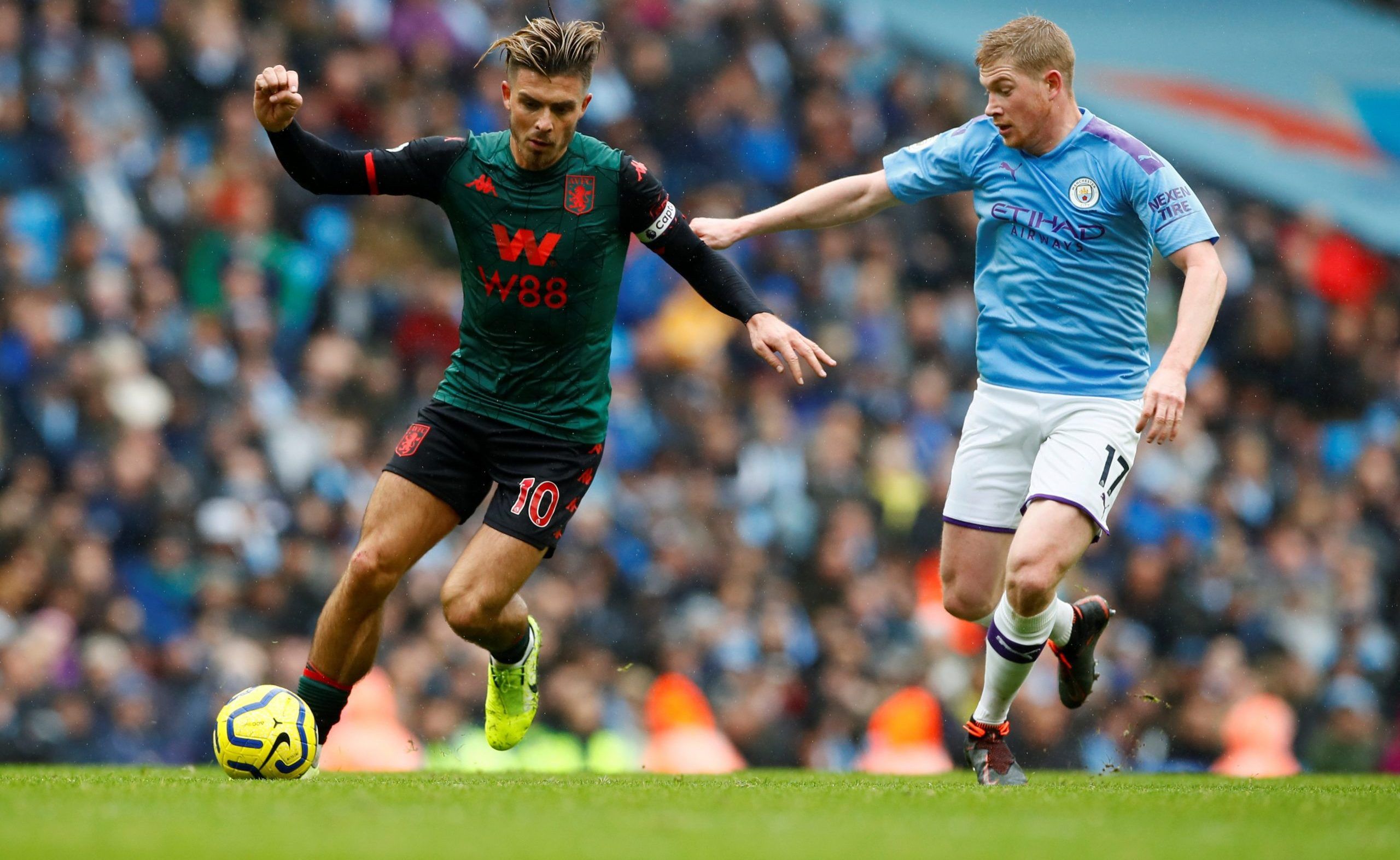 Aston Villa's Jack Grealish in action with Manchester City's Kevin De Bruyne