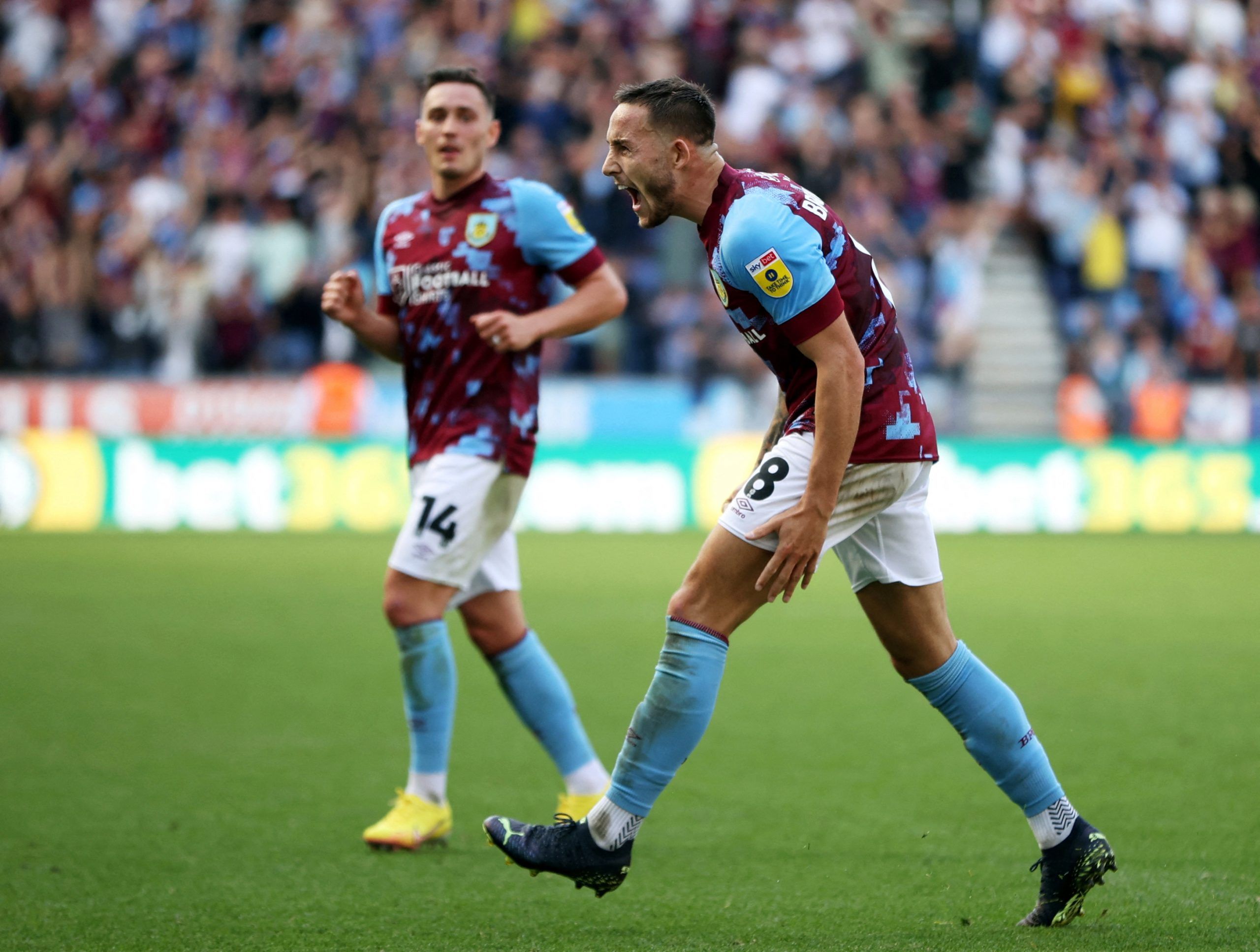 Burnley's Josh Brownhill celebrates with Connor Roberts after scoring their fourth goal