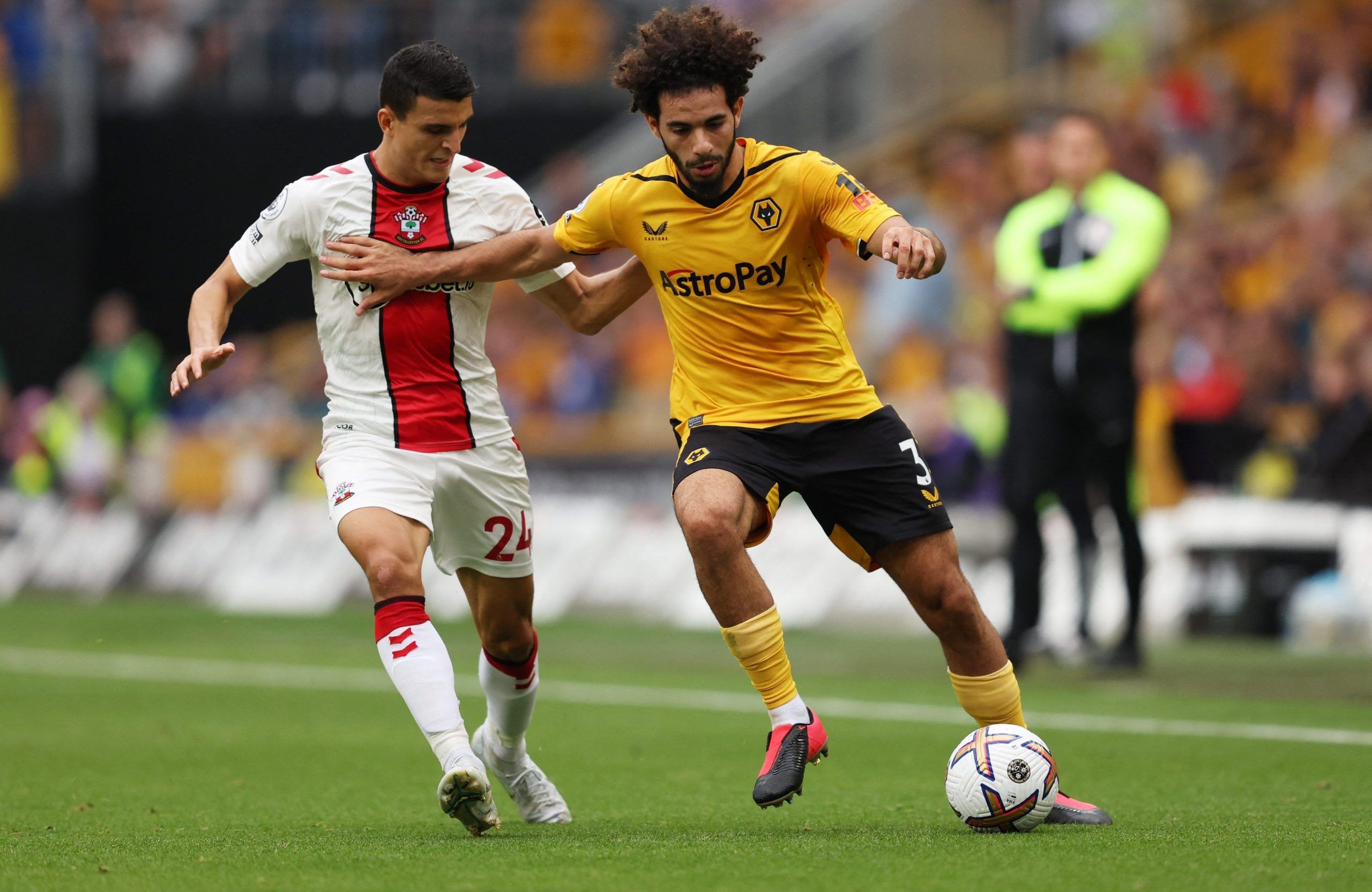 Soccer Football - Premier League - Wolverhampton Wanderers v Southampton - Molineux Stadium, Wolverhampton, Britain - September 3, 2022 Southampton's Mohamed Elyounoussi in action with Wolverhampton Wanderers' Rayan Ait-Nouri Action Images via Reuters/John Clifton EDITORIAL USE ONLY. No use with unauthorized audio, video, data, fixture lists, club/league logos or 'live' services. Online in-match use limited to 75 images, no video emulation. No use in betting, games or single club /league/player 