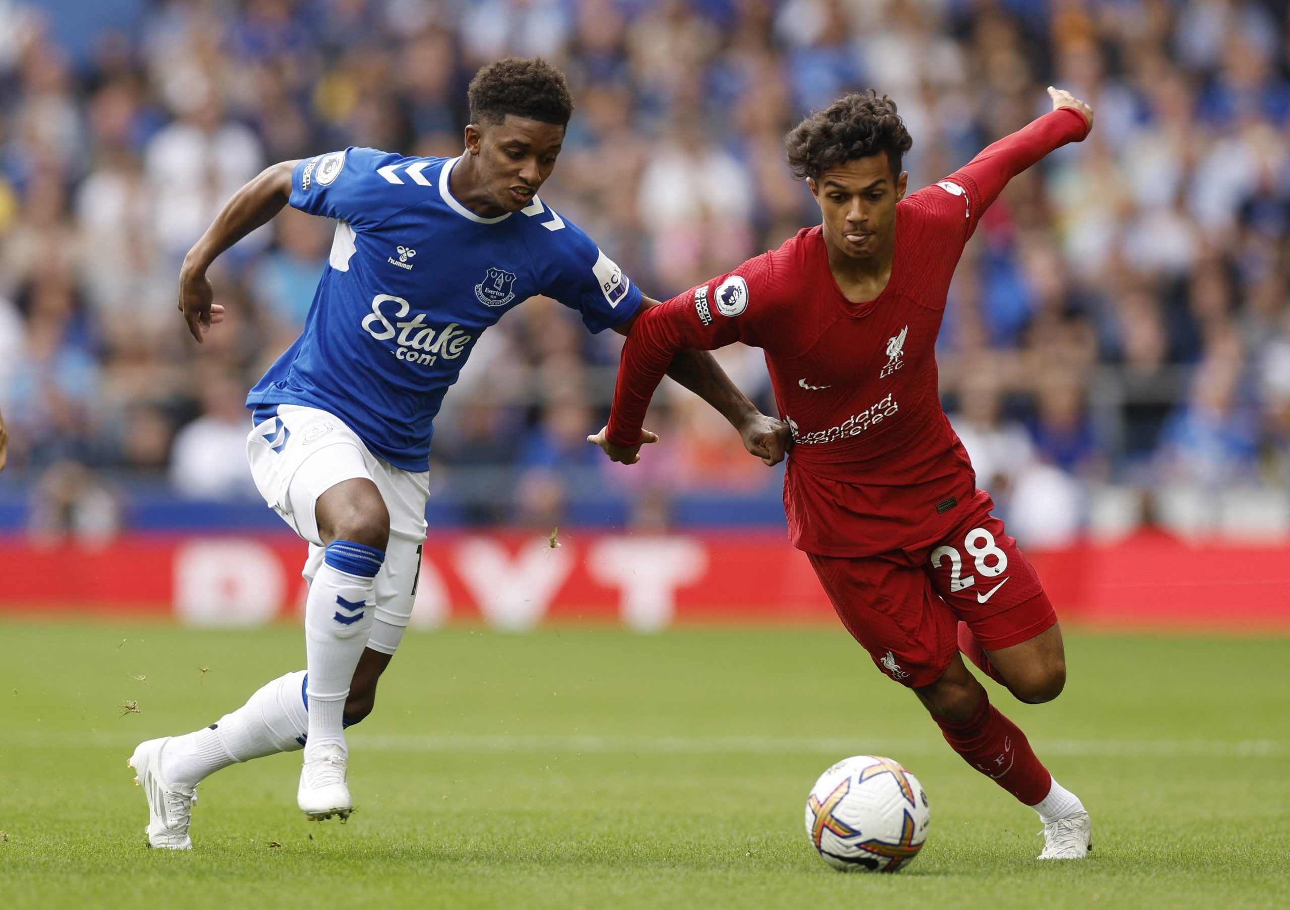 Soccer Football - Premier League - Everton v Liverpool - Goodison Park, Liverpool, Britain - September 3, 2022 Liverpool's Fabio Carvalho in action with Everton's Demarai Gray Action Images via Reuters/Jason Cairnduff EDITORIAL USE ONLY. No use with unauthorized audio, video, data, fixture lists, club/league logos or 'live' services. Online in-match use limited to 75 images, no video emulation. No use in betting, games or single club /league/player publications.  Please contact your account repr
