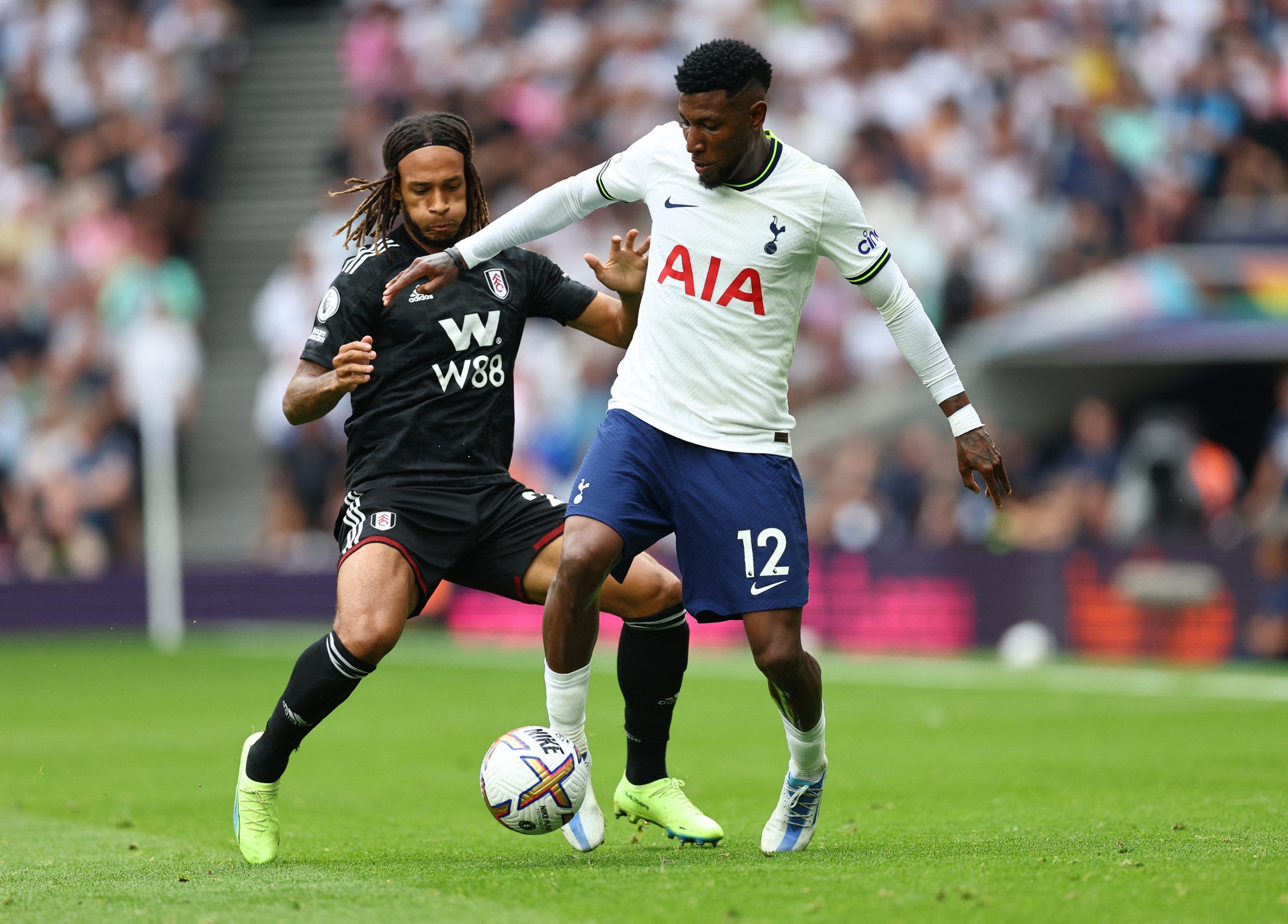 Fulham's Kevin Mbabu in action with Tottenham Hotspur's Emerson Royal 
