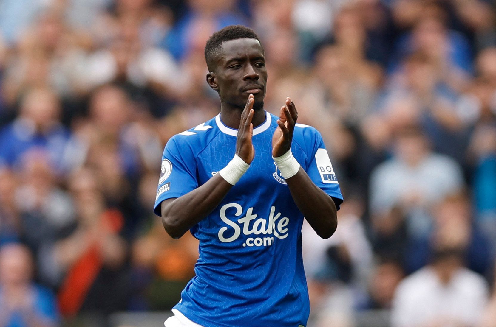 Soccer Football - Premier League - Everton v Liverpool - Goodison Park, Liverpool, Britain - September 3, 2022 Everton's Idrissa Gueye applauds fans after he comes on as as substitute Action Images via Reuters/Jason Cairnduff EDITORIAL USE ONLY. No use with unauthorized audio, video, data, fixture lists, club/league logos or 'live' services. Online in-match use limited to 75 images, no video emulation. No use in betting, games or single club /league/player publications.  Please contact your acco