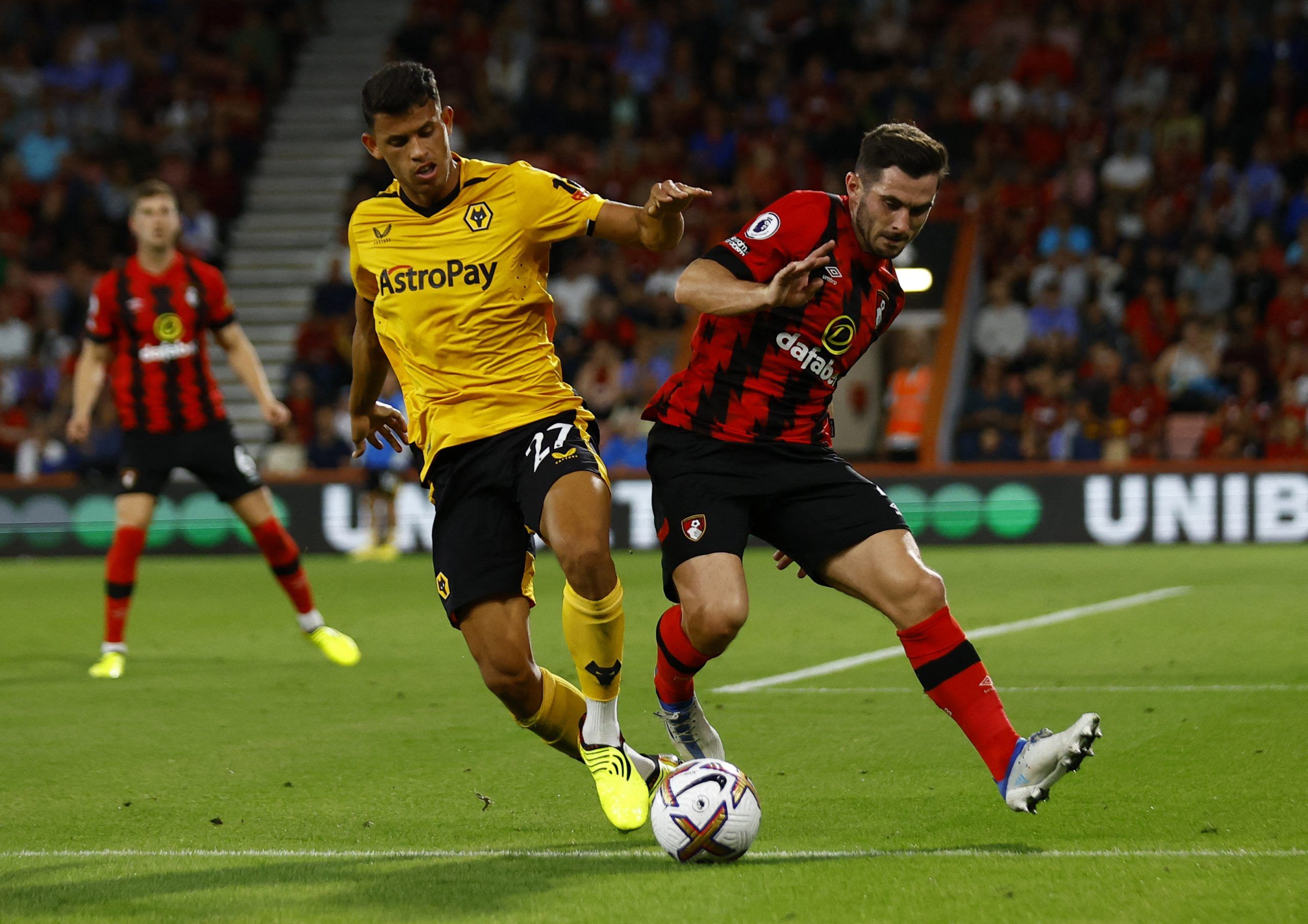 Soccer Football - Premier League - AFC Bournemouth v Wolverhampton Wanderers - Vitality Stadium, Bournemouth, Britain - August 31, 2022 Wolverhampton Wanderers' Matheus Nunes in action with AFC Bournemouth's Lewis Cook Action Images via Reuters/Andrew Boyers EDITORIAL USE ONLY. No use with unauthorized audio, video, data, fixture lists, club/league logos or 'live' services. Online in-match use limited to 75 images, no video emulation. No use in betting, games or single club /league/player public