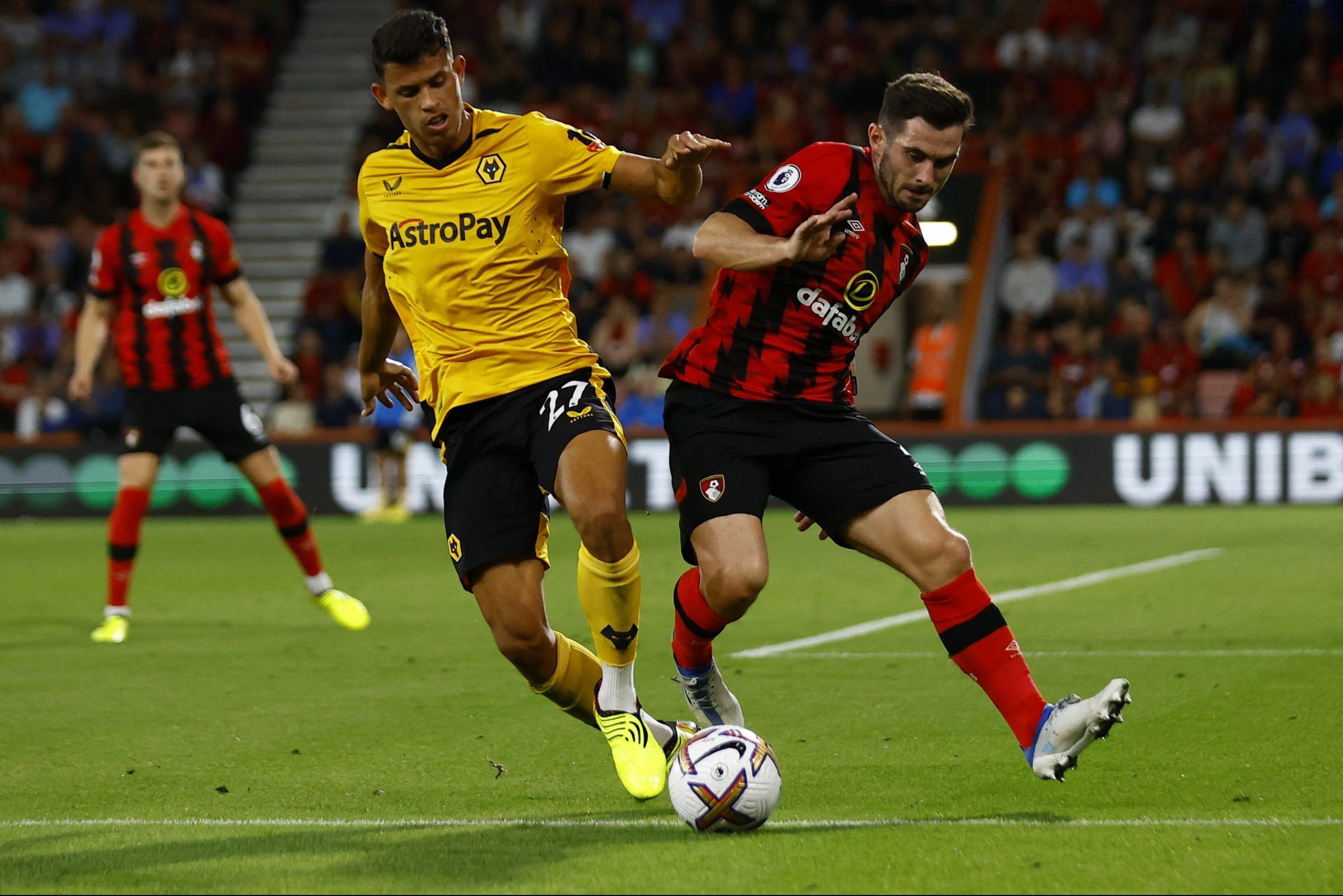 Soccer Football - Premier League - AFC Bournemouth v Wolverhampton Wanderers - Vitality Stadium, Bournemouth, Britain - August 31, 2022 Wolverhampton Wanderers' Matheus Nunes in action with AFC Bournemouth's Lewis Cook Action Images via Reuters/Andrew Boyers EDITORIAL USE ONLY. No use with unauthorized audio, video, data, fixture lists, club/league logos or 'live' services. Online in-match use limited to 75 images, no video emulation. No use in betting, games or single club /league/player public