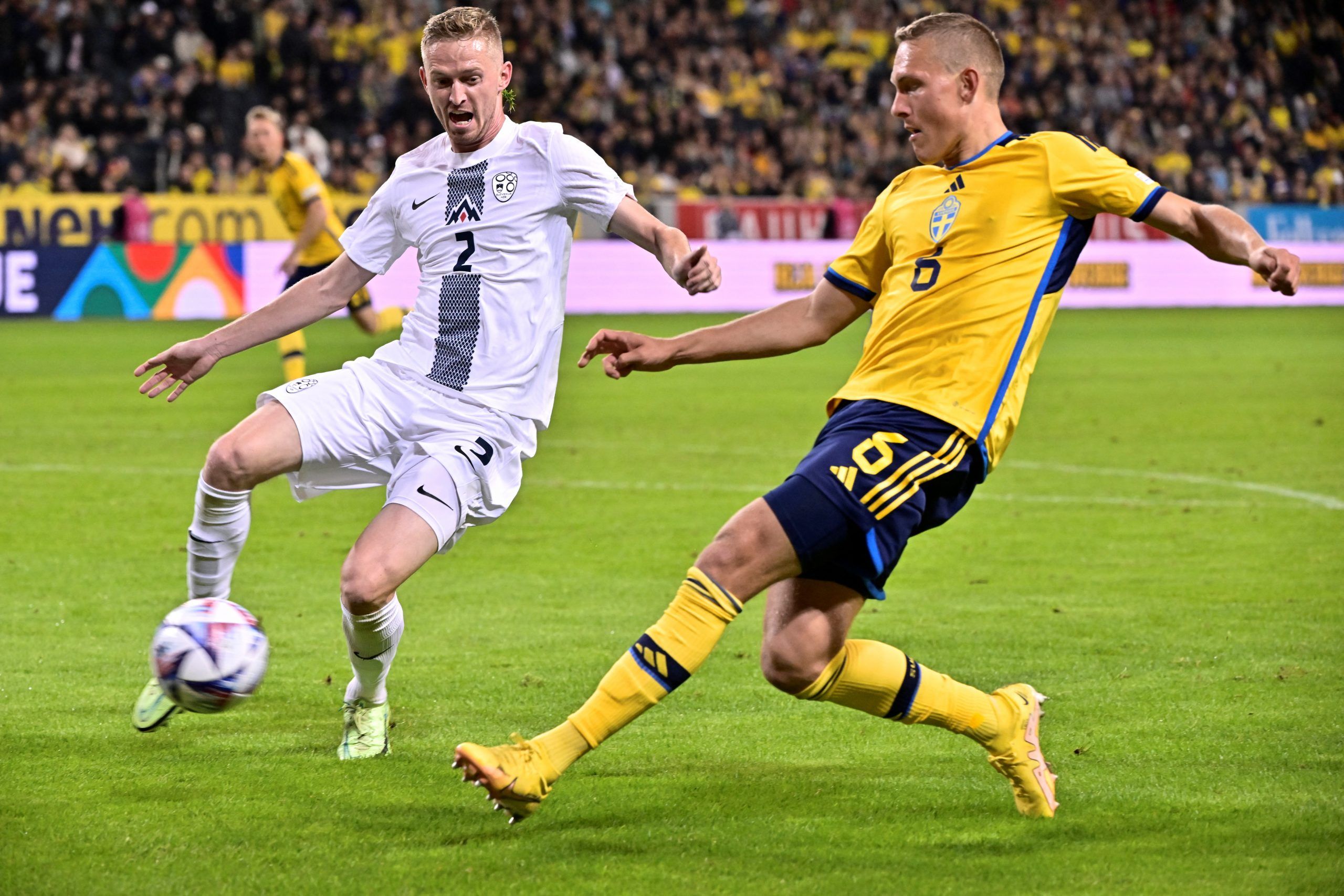 Slovenia's Zan Karnicnik in action with Sweden's Ludwig Augustinsson