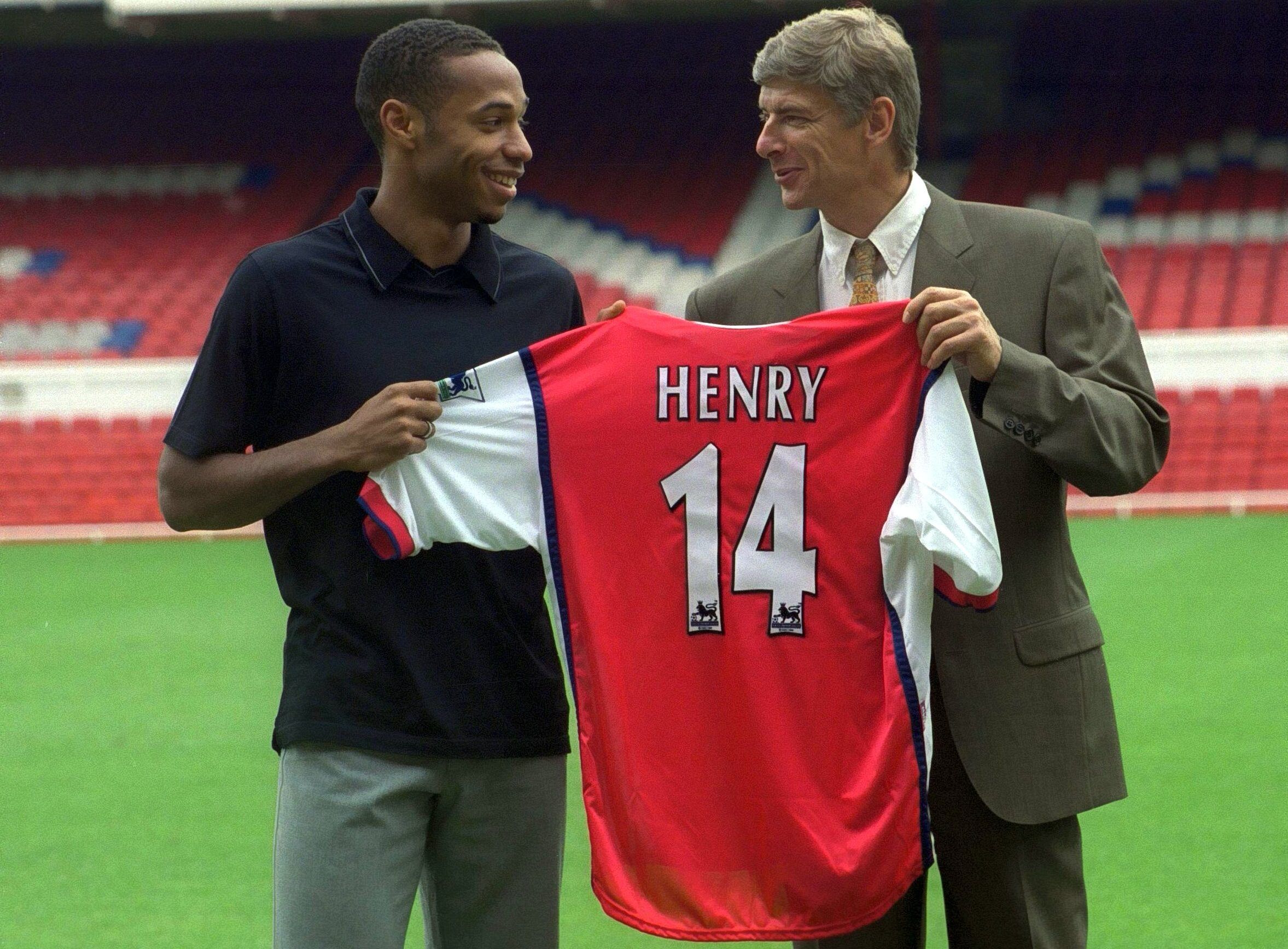 Football - Arsenal Press Conference - Highbury - 3/8/99 
New Signing Thierry Henry holds his Number 14 shirt with Arsene Wenger - Arsenal Manager 
Mandatory Credit: Action Images / Andrew Couldridge