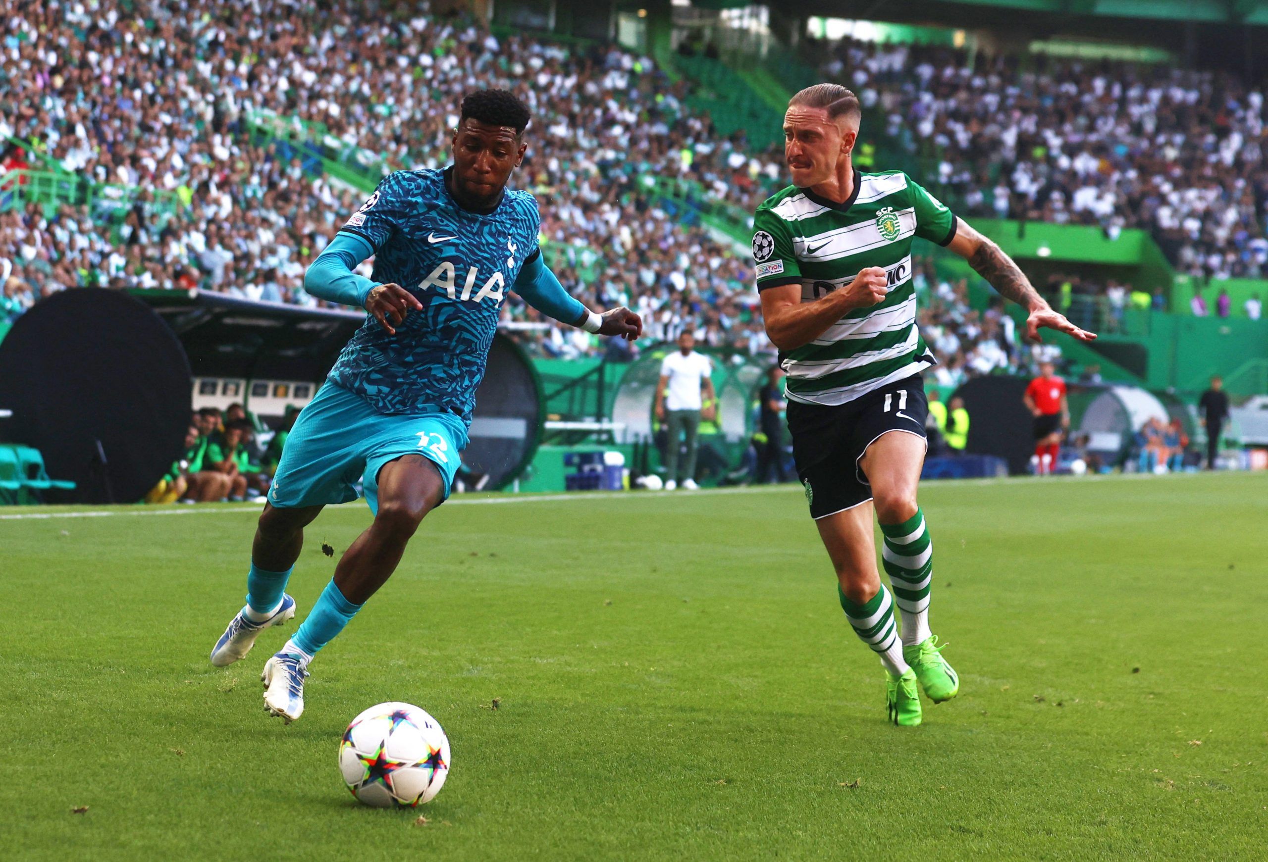 Tottenham Hotspur's Emerson Royal in action with Sporting CP's Nuno Santos