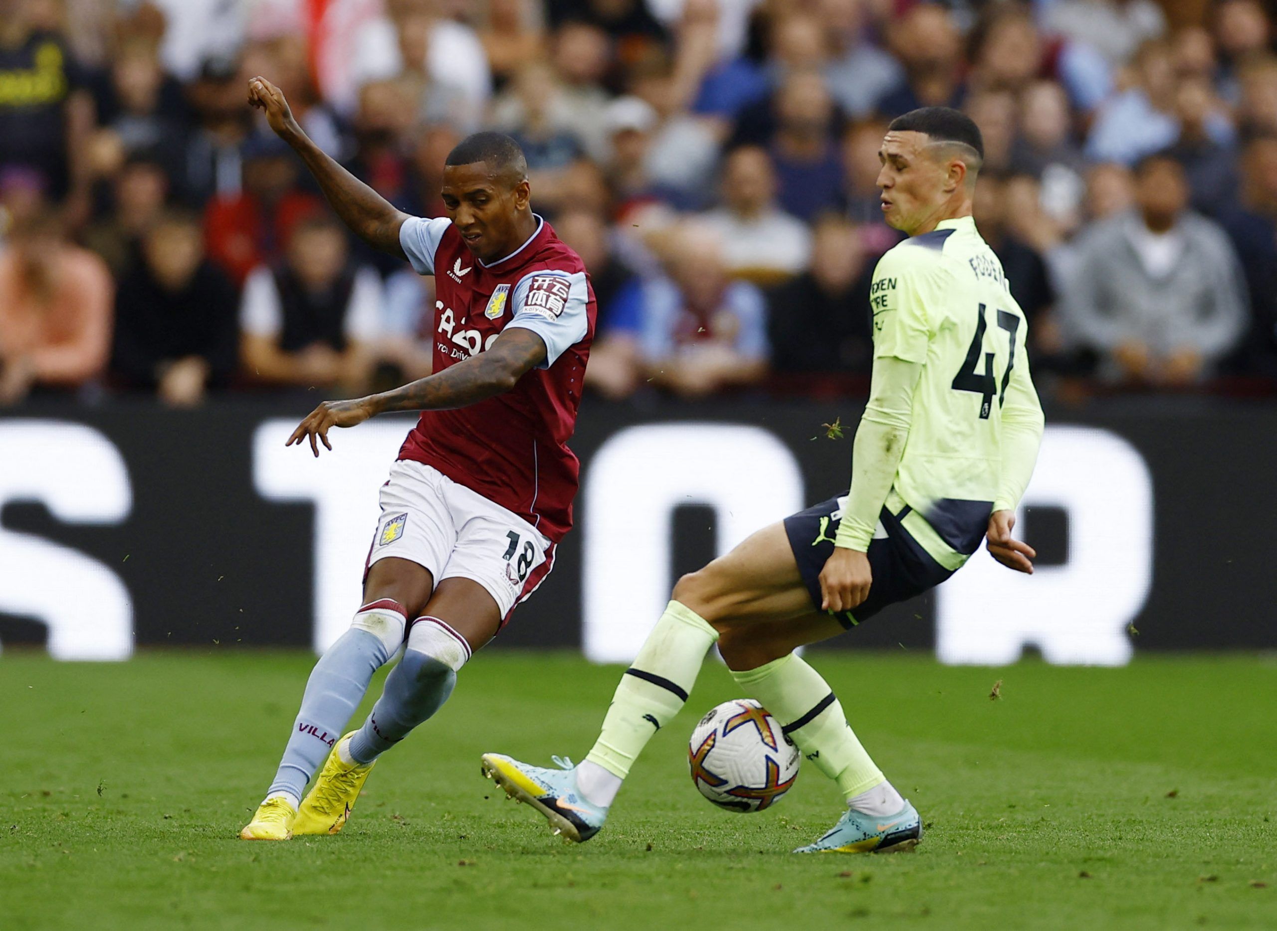 Soccer Football - Premier League - Aston Villa v Manchester City - Villa Park, Birmingham, Britain - September 3, 2022 Aston Villa's Ashley Young in action with Manchester City's Phil Foden Action Images via Reuters/Andrew Boyers EDITORIAL USE ONLY. No use with unauthorized audio, video, data, fixture lists, club/league logos or 'live' services. Online in-match use limited to 75 images, no video emulation. No use in betting, games or single club /league/player publications.  Please contact your 