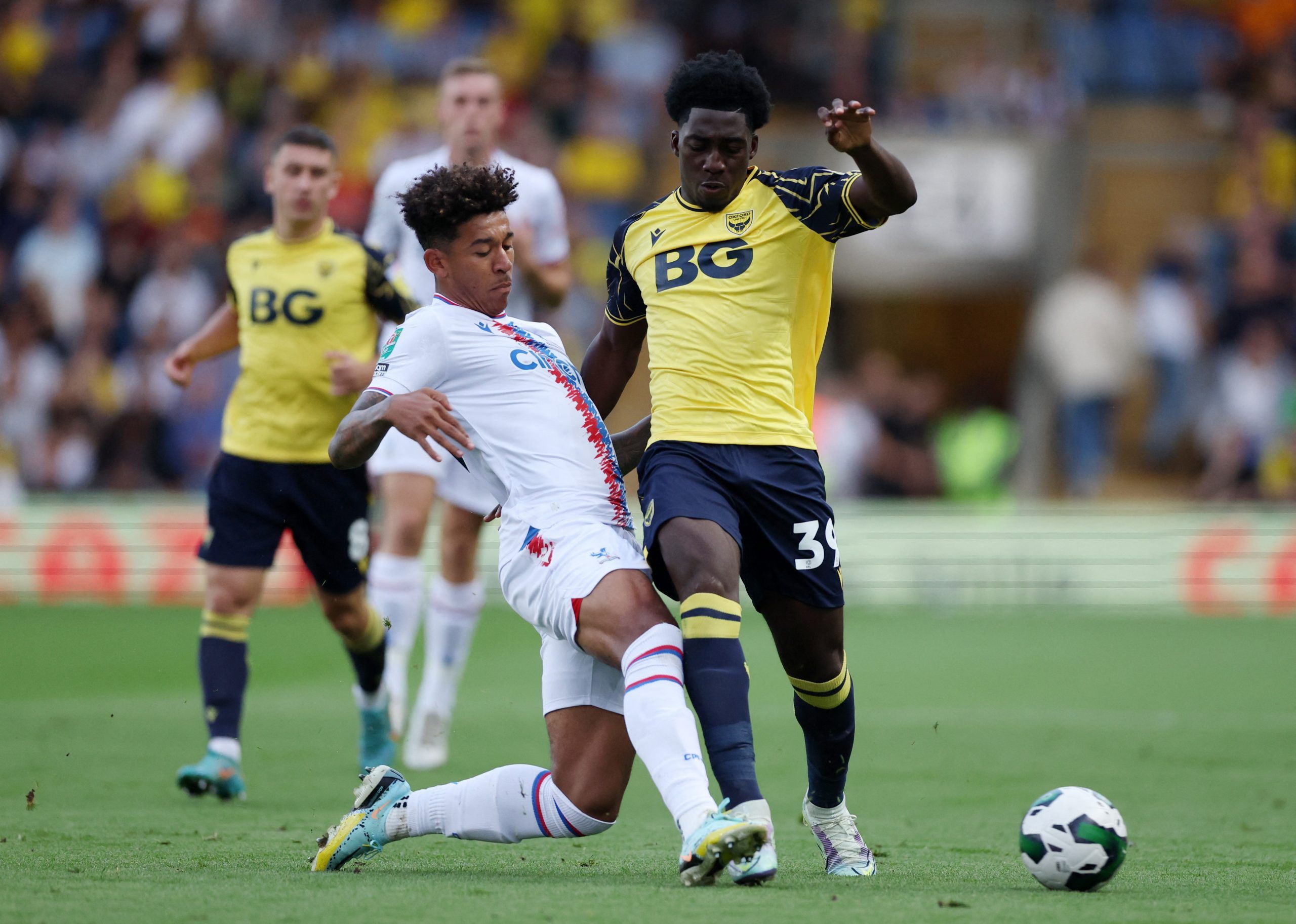 Soccer Football - Carabao Cup Second Round - Oxford United v Crystal Palace - Kassam Stadium, Oxford, Britain - August 23, 2022 Crystal Palace's Chris Richards in action with Oxford United's Gatlin O'Donkor Action Images via Reuters/Matthew Childs EDITORIAL USE ONLY. No use with unauthorized audio, video, data, fixture lists, club/league logos or 'live' services. Online in-match use limited to 75 images, no video emulation. No use in betting, games or single club /league/player publications.  Pl