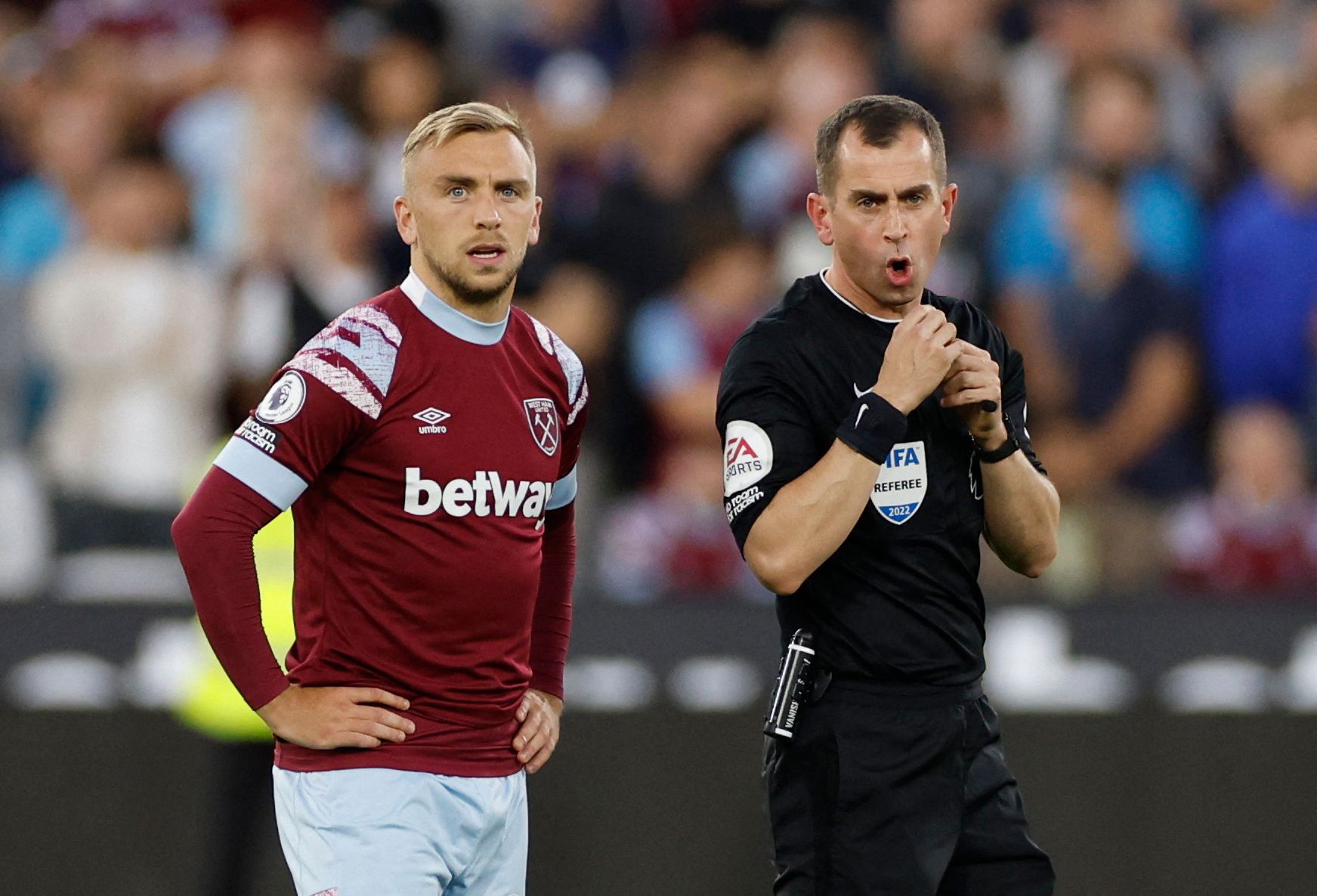 Soccer Football - Premier League - West Ham United v Tottenham Hotspur - London Stadium, London, Britain - August 31, 2022 West Ham United's Jarrod Bowen and referee Peter Bankes before the match Action Images via Reuters/John Sibley EDITORIAL USE ONLY. No use with unauthorized audio, video, data, fixture lists, club/league logos or 'live' services. Online in-match use limited to 75 images, no video emulation. No use in betting, games or single club /league/player publications.  Please contact y