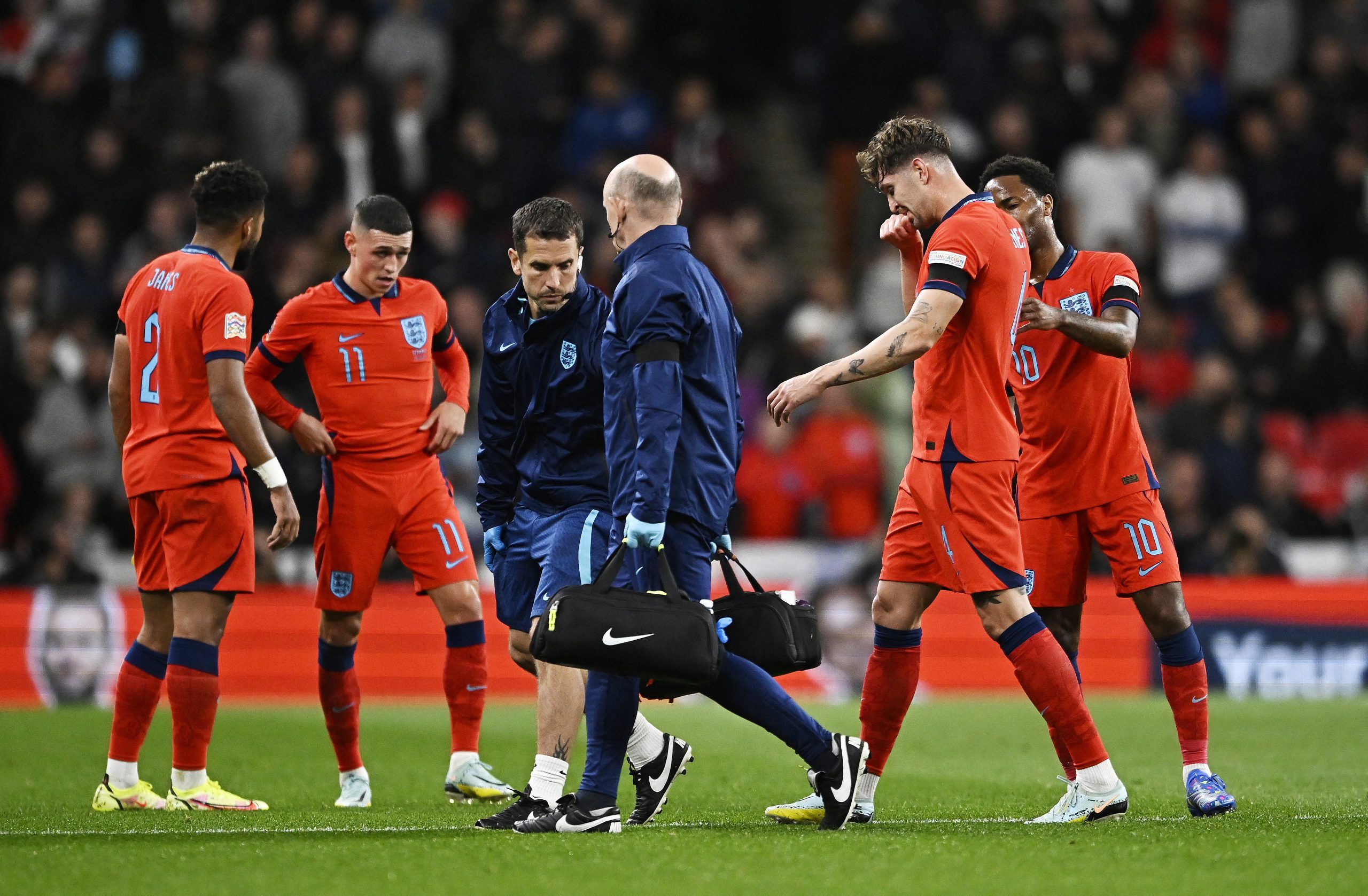 Soccer Football - UEFA Nations League - Group C - England v Germany - Wembley Stadium, London, Britain - September 26, 2022 England's John Stones walks off to substituted after sustaining an injury REUTERS/Tony Obrien