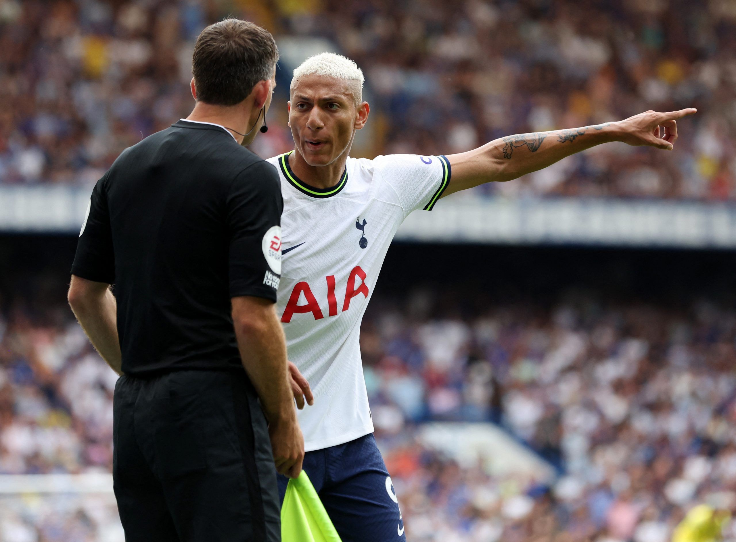 Soccer Football - Premier League - Chelsea v Tottenham Hotspur - Stamford Bridge, London, Britain - August 14, 2022 Tottenham Hotspur's Richarlison remonstrates with the referees assistant Action Images via Reuters/Paul Childs EDITORIAL USE ONLY. No use with unauthorized audio, video, data, fixture lists, club/league logos or 'live' services. Online in-match use limited to 75 images, no video emulation. No use in betting, games or single club /league/player publications.  Please contact your acc