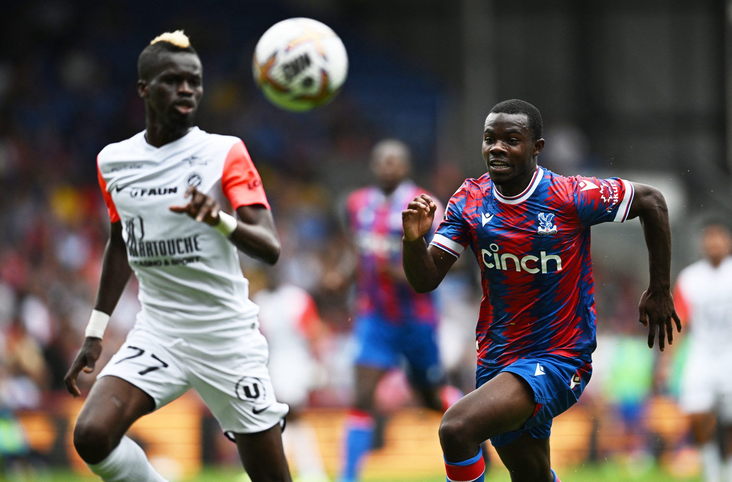 Soccer Football - Pre Season Friendly - Crystal Palace v Montpellier - Selhurst Park, London, Britain - July 30, 2022 Montpellier's Falaye Sacko in action with Crystal Palace's Tyrick Mitchell REUTERS/Dylan Martinez