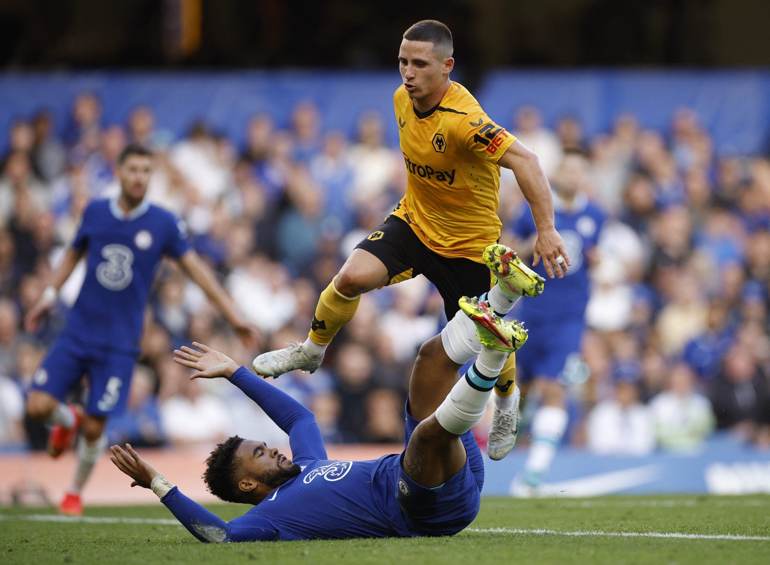 Soccer Football - Premier League - Chelsea v Wolverhampton Wanderers - Stamford Bridge, London, Britain - October 8, 2022 Wolverhampton Wanderers' Daniel Podence in action with Chelsea's Reece James Action Images via Reuters/John Sibley EDITORIAL USE ONLY. No use with unauthorized audio, video, data, fixture lists, club/league logos or 'live' services. Online in-match use limited to 75 images, no video emulation. No use in betting, games or single club /league/player publications.  Please contac