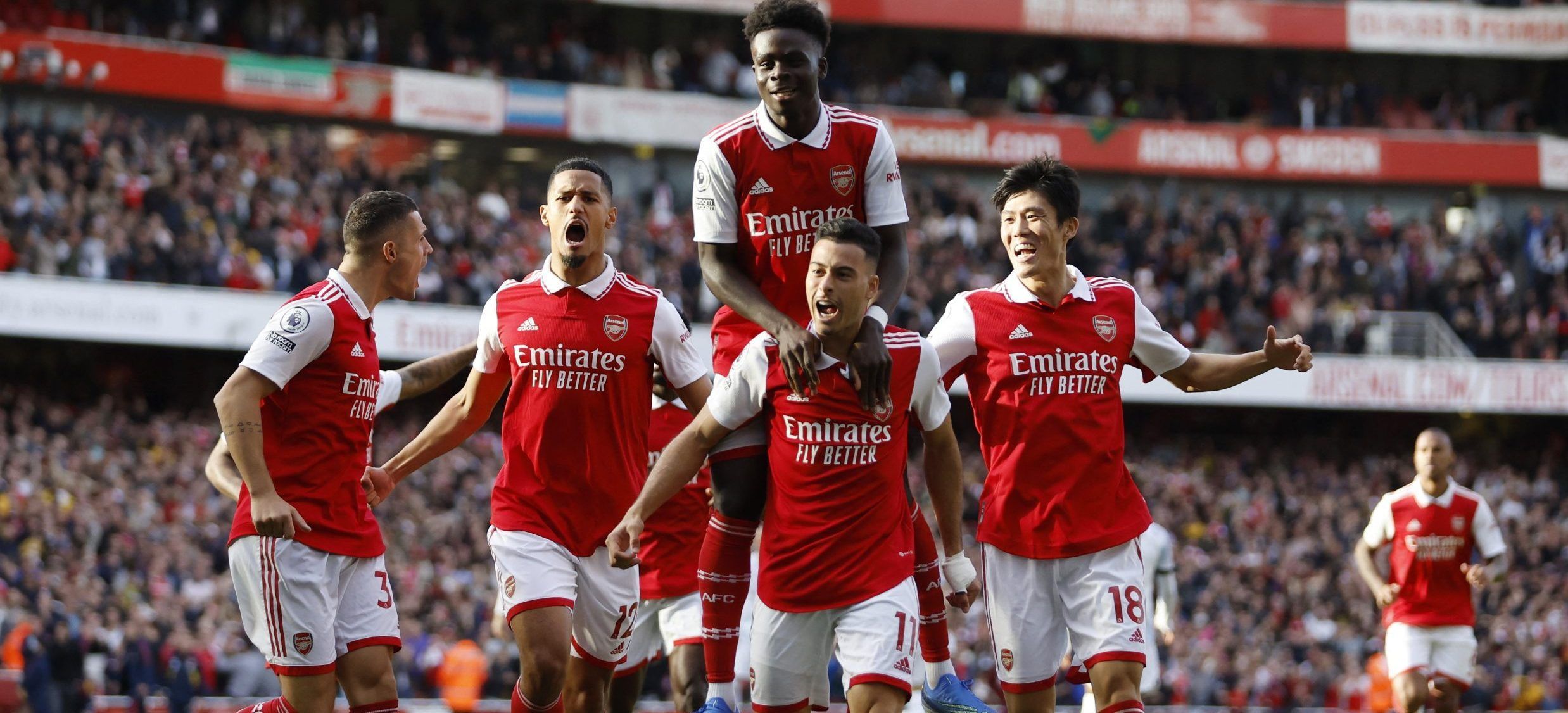 Soccer Football - Premier League - Arsenal v Liverpool - Emirates Stadium, London, Britain - October 9, 2022 Arsenal's Gabriel Martinelli celebrates scoring their first goal with Takehiro Tomiyasu, Granit Xhaka, William Saliba and Bukayo Saka Action Images via Reuters/Peter Cziborra EDITORIAL USE ONLY. No use with unauthorized audio, video, data, fixture lists, club/league logos or 'live' services. Online in-match use limited to 75 images, no video emulation. No use in betting, games or single c