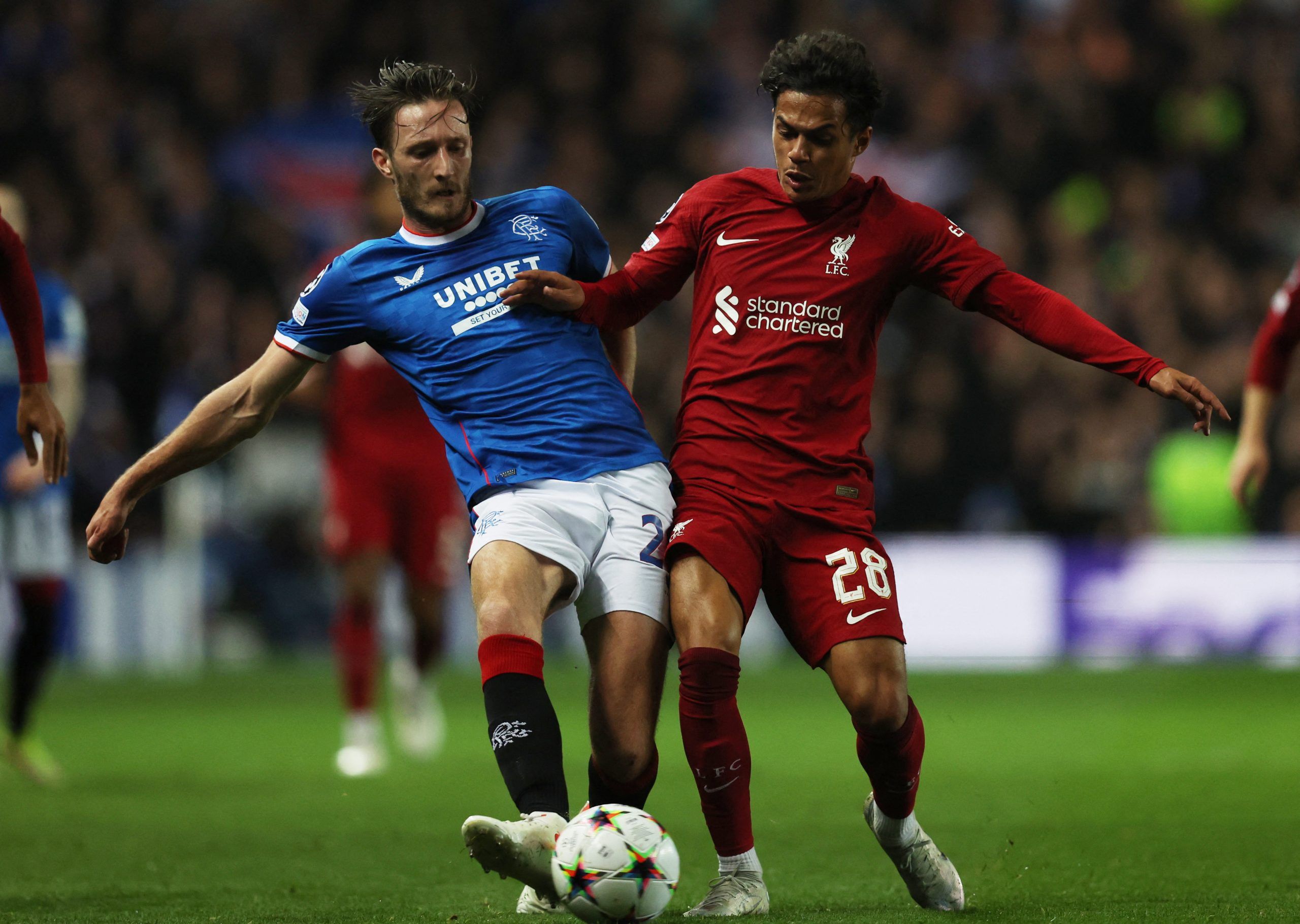 Soccer Football - Champions League - Group A - Rangers v Liverpool - Ibrox Stadium, Glasgow, Scotland, Britain - October 12, 2022 Rangers' Ben Davies in action with Liverpool's Fabio Carvalho REUTERS/Russell Cheyne