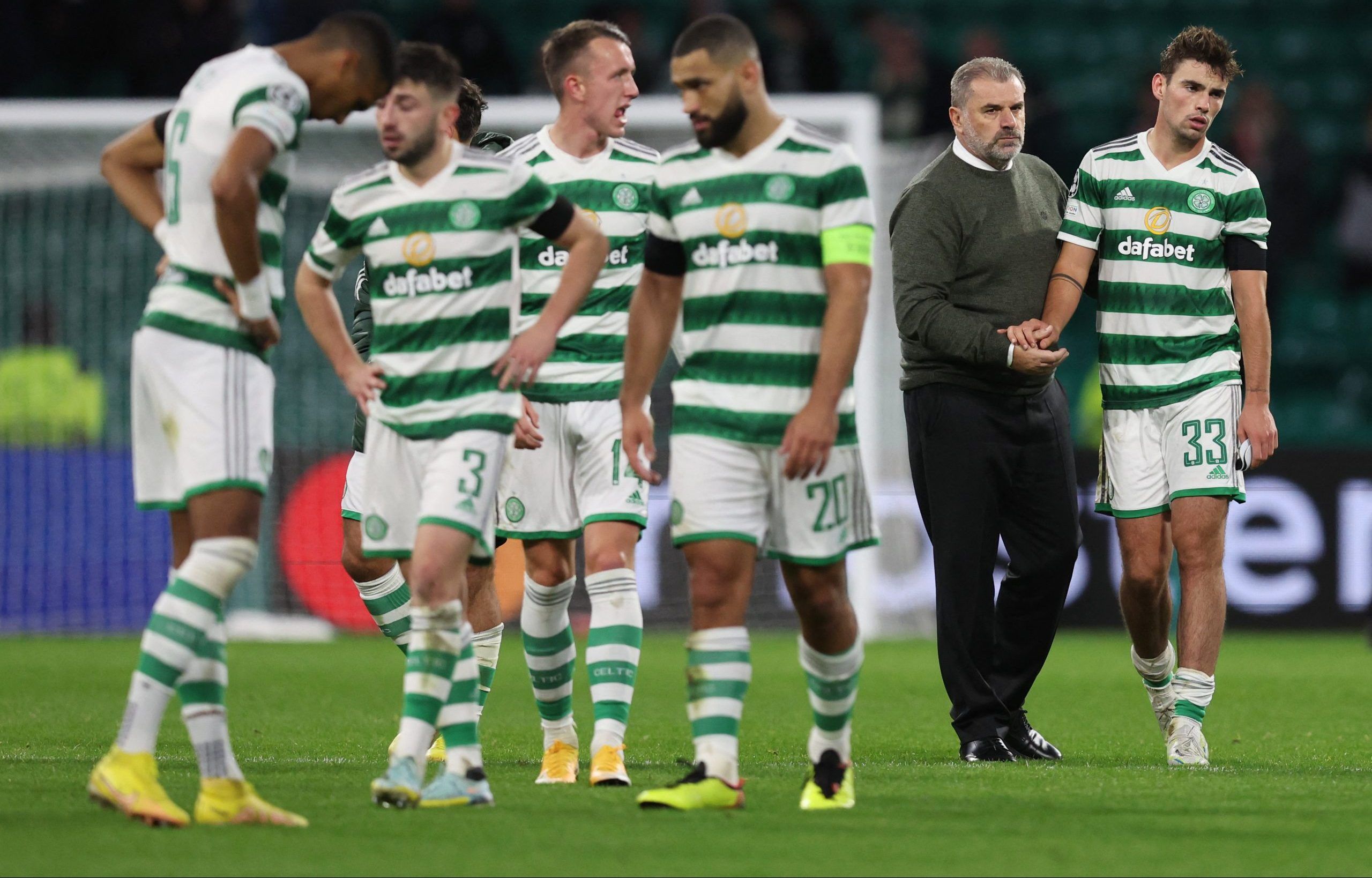 Soccer Football - Champions League - Group F - Celtic v RB Leipzig - Celtic Park, Glasgow, Scotland, Britain - October 11, 2022  Celtic's Matt O'Riley and manager Ange Postecoglu look dejected after the match REUTERS/Russell Cheyne