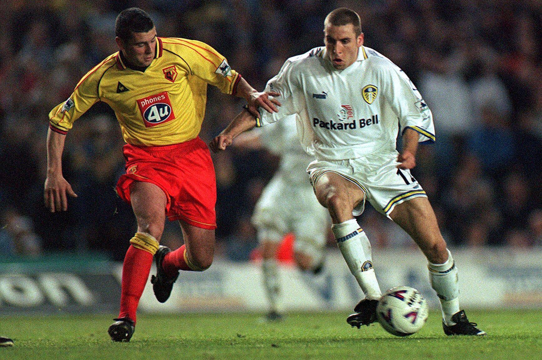 Football - Leed United v Watford , FA Premier League  3/5/00 
Mandatory Credit:Action Images/David Davies 
Leeds' Darren Huckerby is challenged by Watford's Paul Robinson.