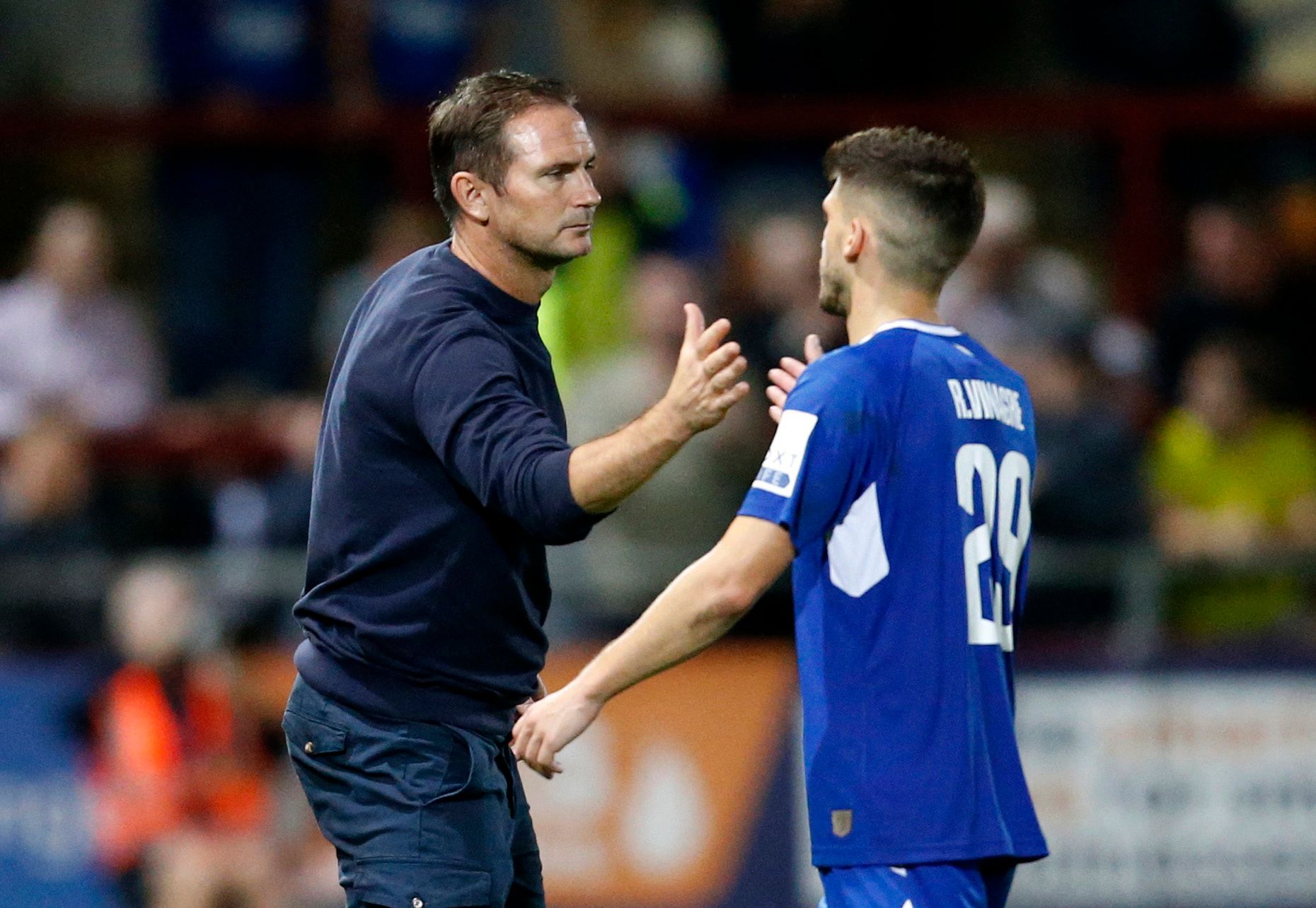 Soccer Football - Carabao Cup Second Round - Fleetwood Town v Everton - Highbury Stadium, Fleetwood, Britain - August 23, 2022 Everton manager Frank Lampard shakes hands with Ruben Vinagre after the match Action Images via Reuters/Ed Sykes EDITORIAL USE ONLY. No use with unauthorized audio, video, data, fixture lists, club/league logos or 'live' services. Online in-match use limited to 75 images, no video emulation. No use in betting, games or single club /league/player publications.  Please con