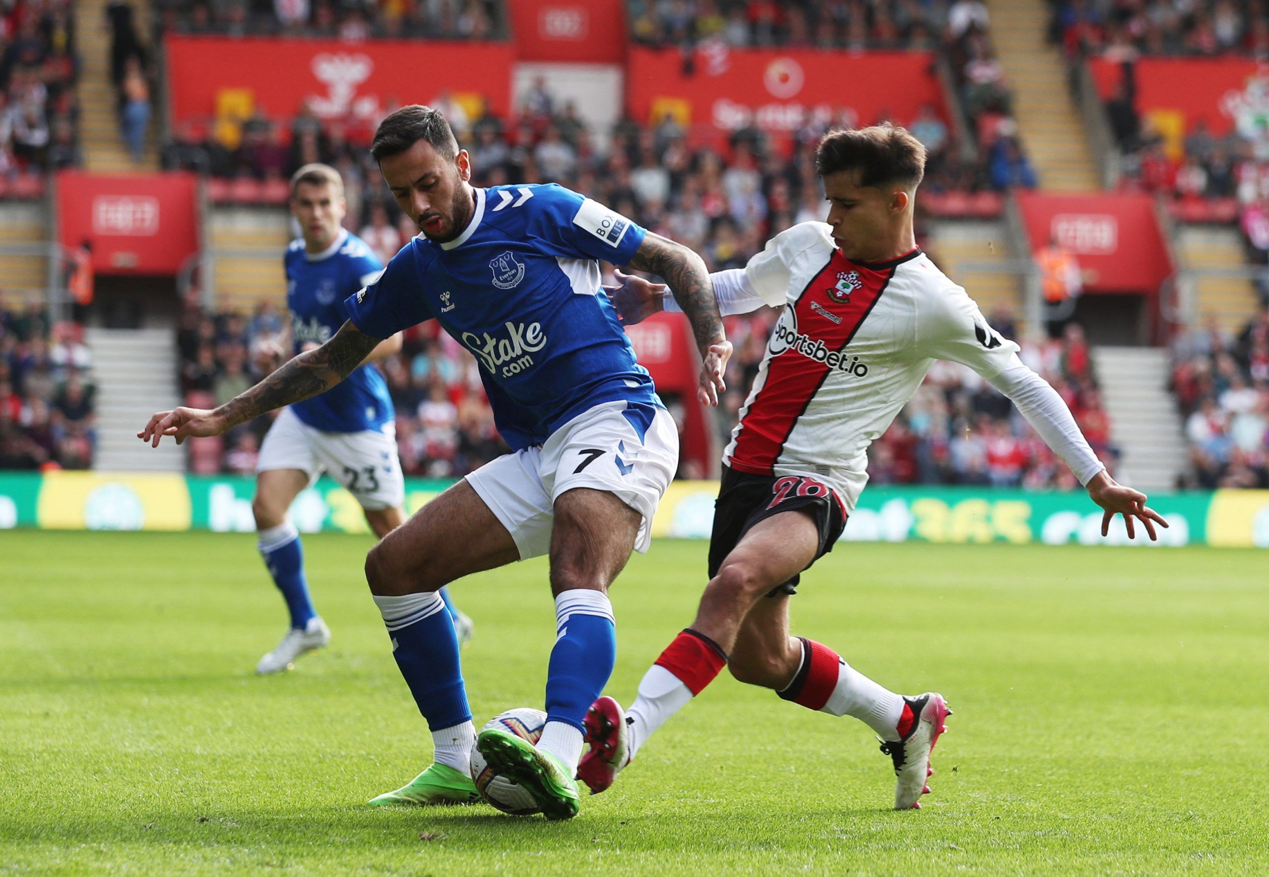 Soccer Football - Premier League - Southampton v Everton - St Mary's Stadium, Southampton, Britain - October 1, 2022 Everton's Dwight McNeil in action with Southampton's Juan Larios REUTERS/Chris Radburn EDITORIAL USE ONLY. No use with unauthorized audio, video, data, fixture lists, club/league logos or 'live' services. Online in-match use limited to 75 images, no video emulation. No use in betting, games or single club /league/player publications.  Please contact your account representative for