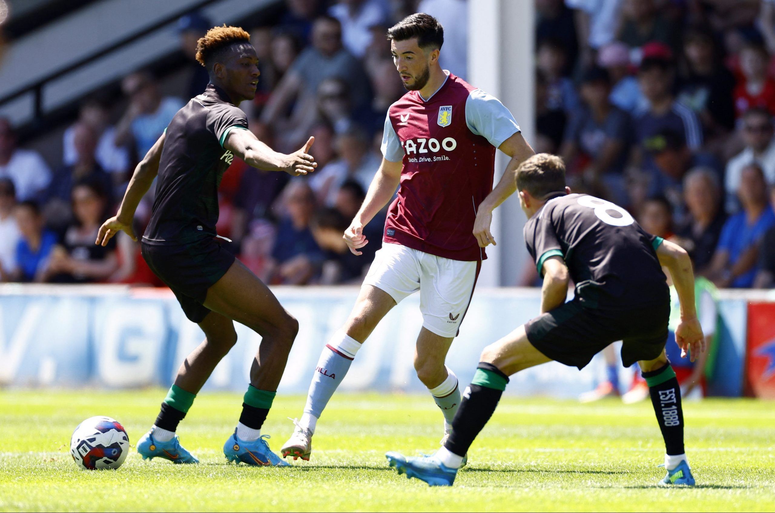 Soccer Football - Pre Season Friendly - Walsall v Aston Villa - Bescot Stadium, Walsall, Britain - July 9, 2022 Aston Villa's Finn Azaz in action with Walsall's Timmy Abraham and Liam Kinsella Action Images via Reuters/Andrew Boyers