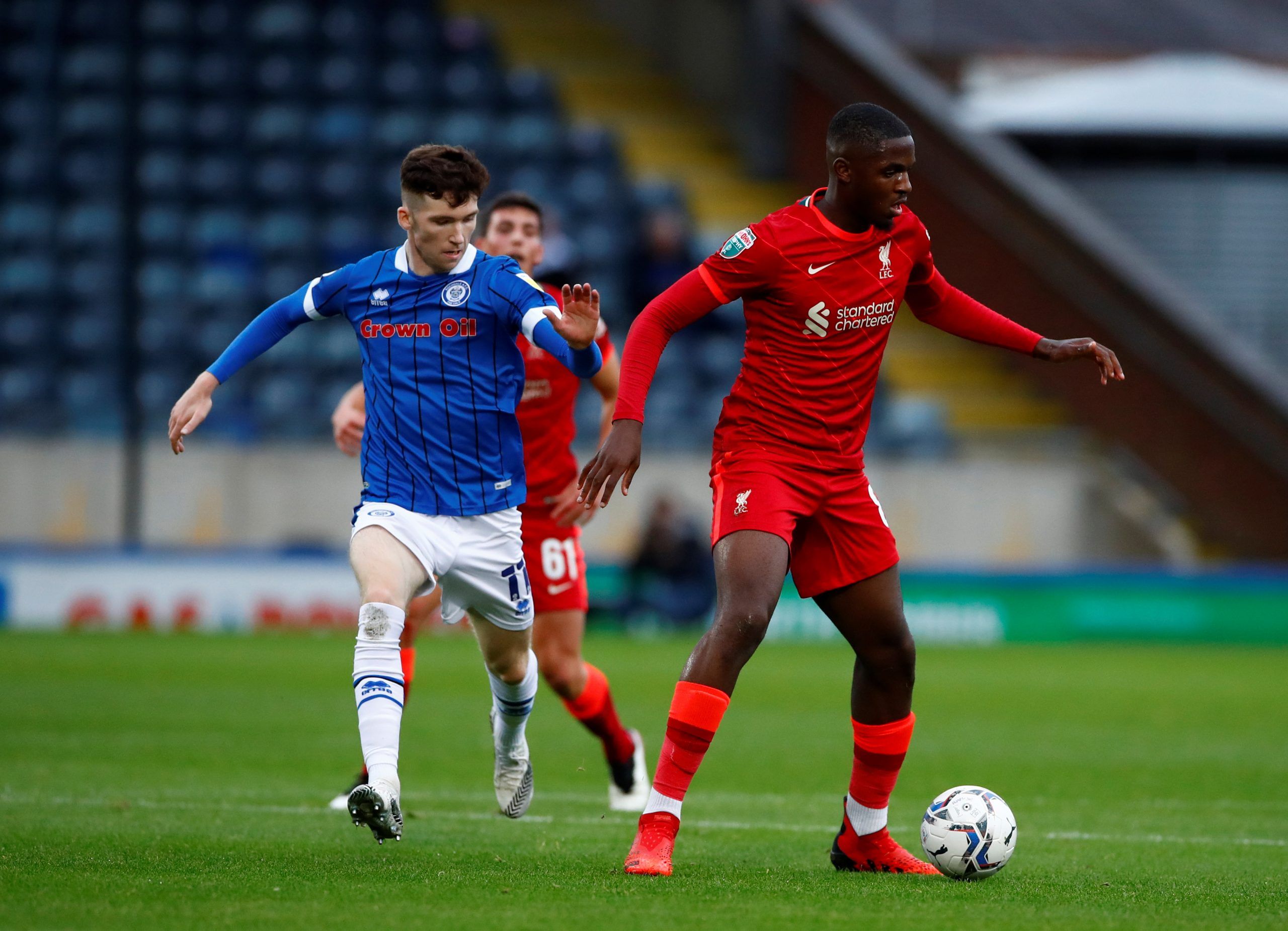 Soccer Football - EFL Trophy - Group Stage - Northern Group D - Rochdale v Liverpool U21 - Spotland Stadium, Rochdale, Britain - August 31, 2021   Liverpool's Billy Koumetio in action with Rochdale's Conor Grant   Action Images/Jason Cairnduff    EDITORIAL USE ONLY. No use with unauthorized audio, video, data, fixture lists, club/league logos or 
