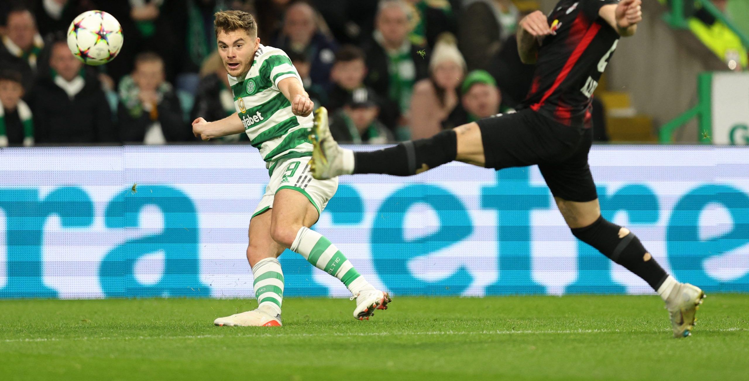 Soccer Football - Champions League - Group F - Celtic v RB Leipzig - Celtic Park, Glasgow, Scotland, Britain - October 11, 2022  Celtic's James Forrest in action with RB Leipzig's David Raum REUTERS/Russell Cheyne