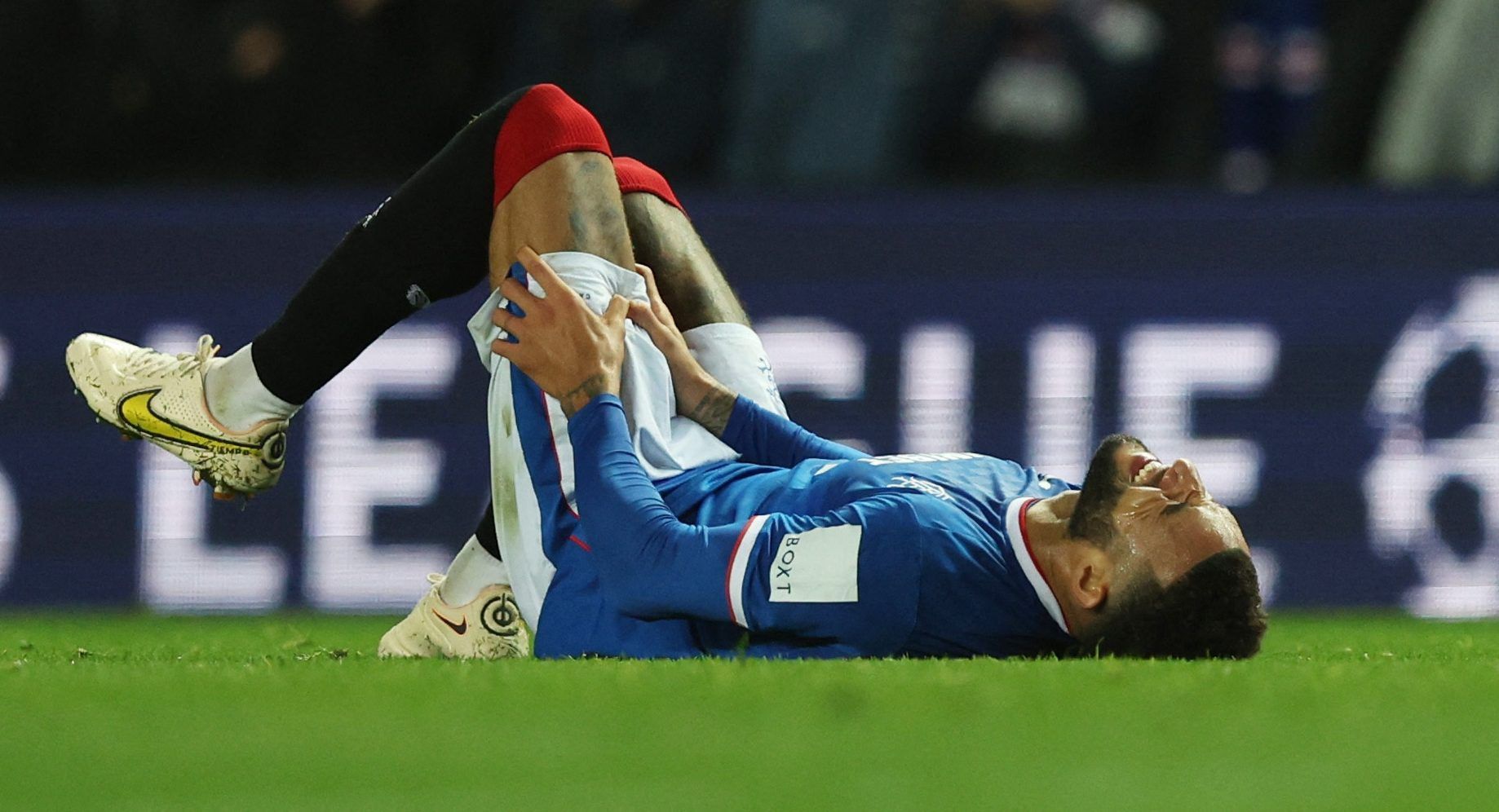 Soccer Football - Champions League - Group A - Rangers v Liverpool - Ibrox Stadium, Glasgow, Scotland, Britain - October 12, 2022 Rangers' Connor Goldson reacts after sustaining an injury REUTERS/Russell Cheyne